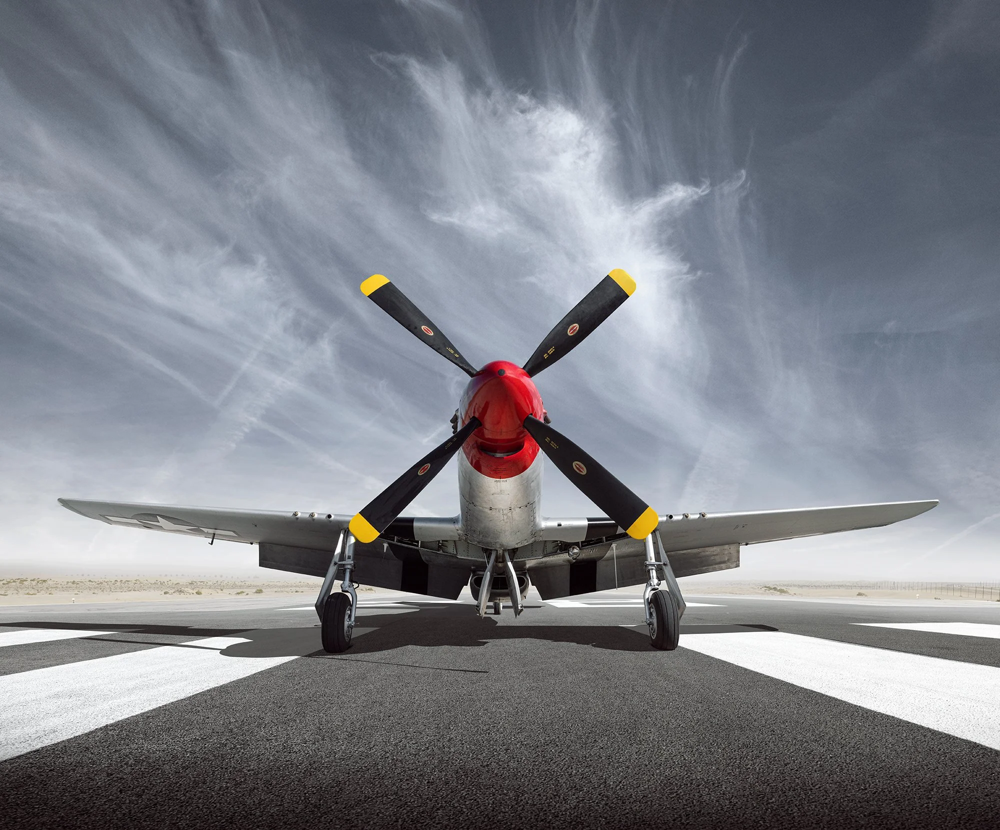 Front view of a P51 Mustang on runway