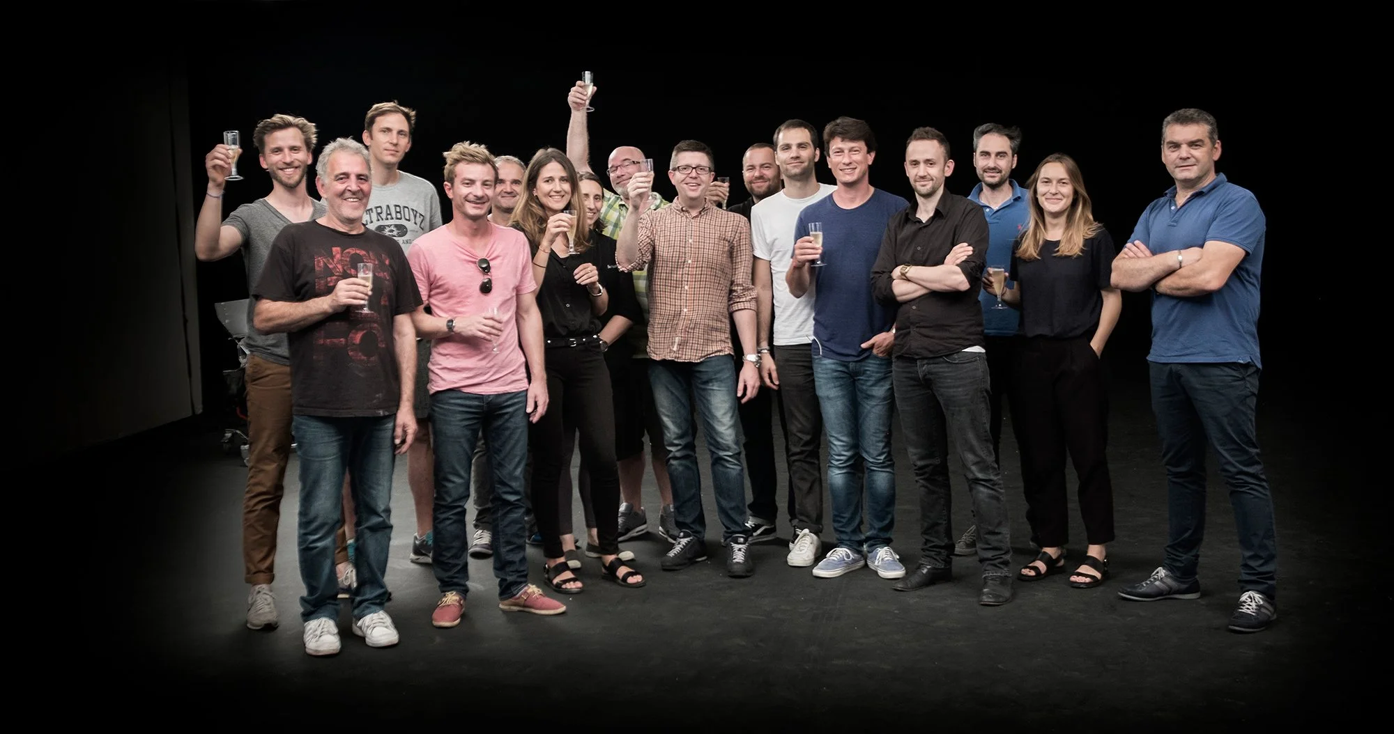Tim Wallace with team in studio celebrating after a completed car shoot.