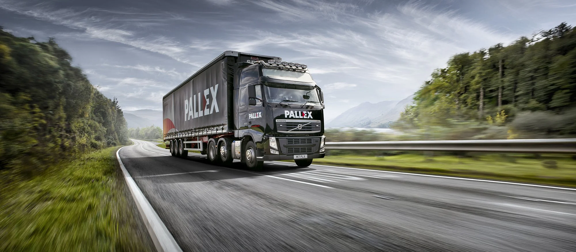 Pallex truck driving on a country road.