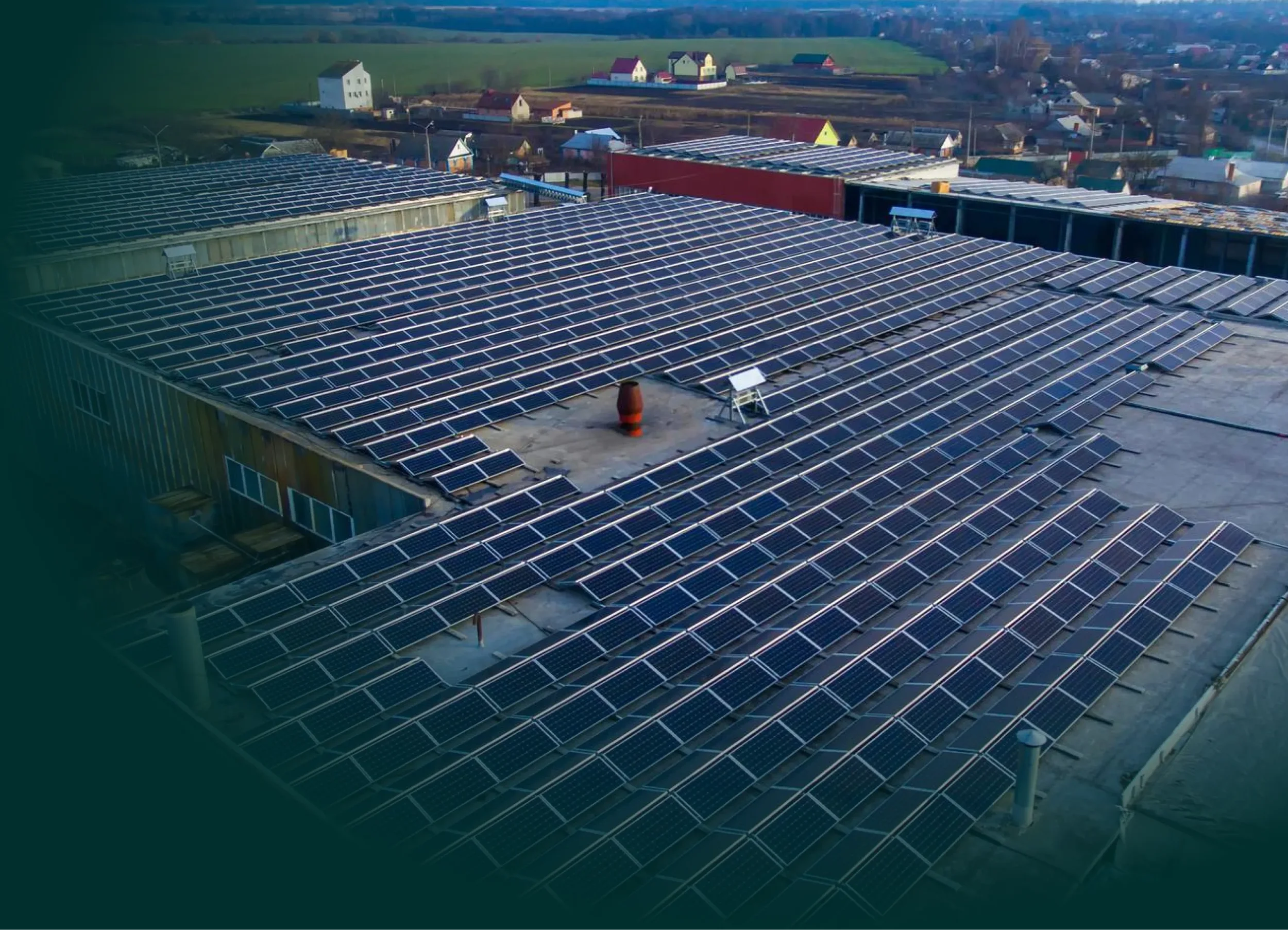 A rooftop covered with numerous solar panels.