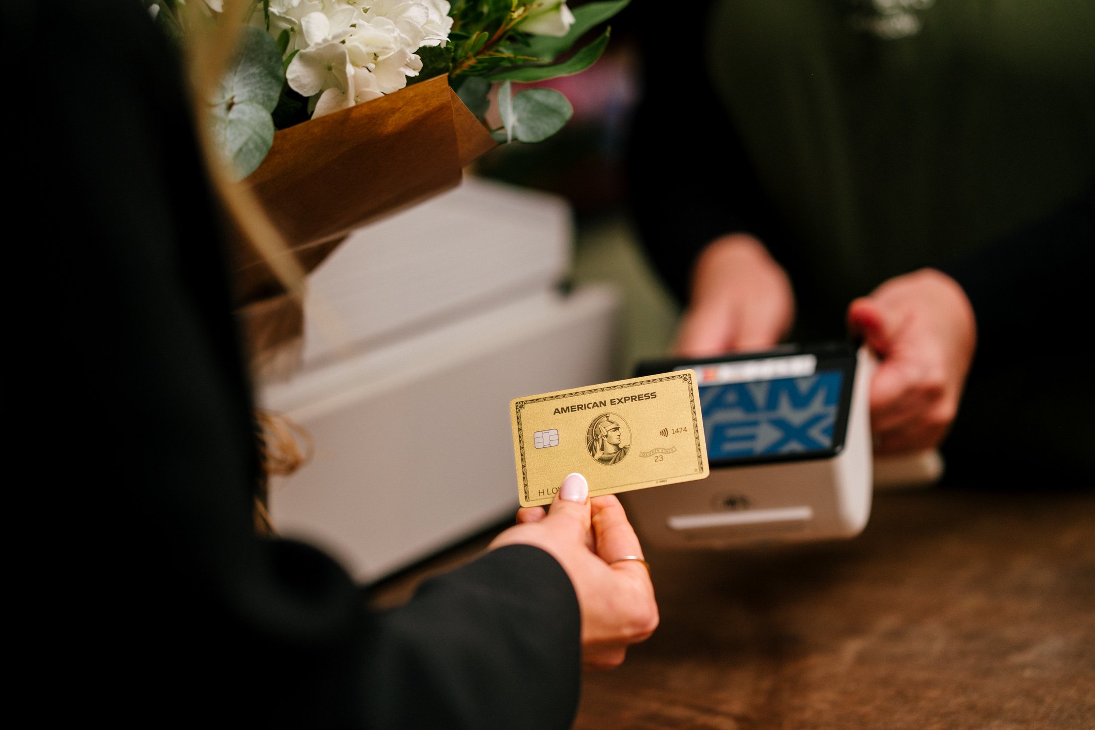 A photo of an American Express card being used for the Shop Small Campaign. 