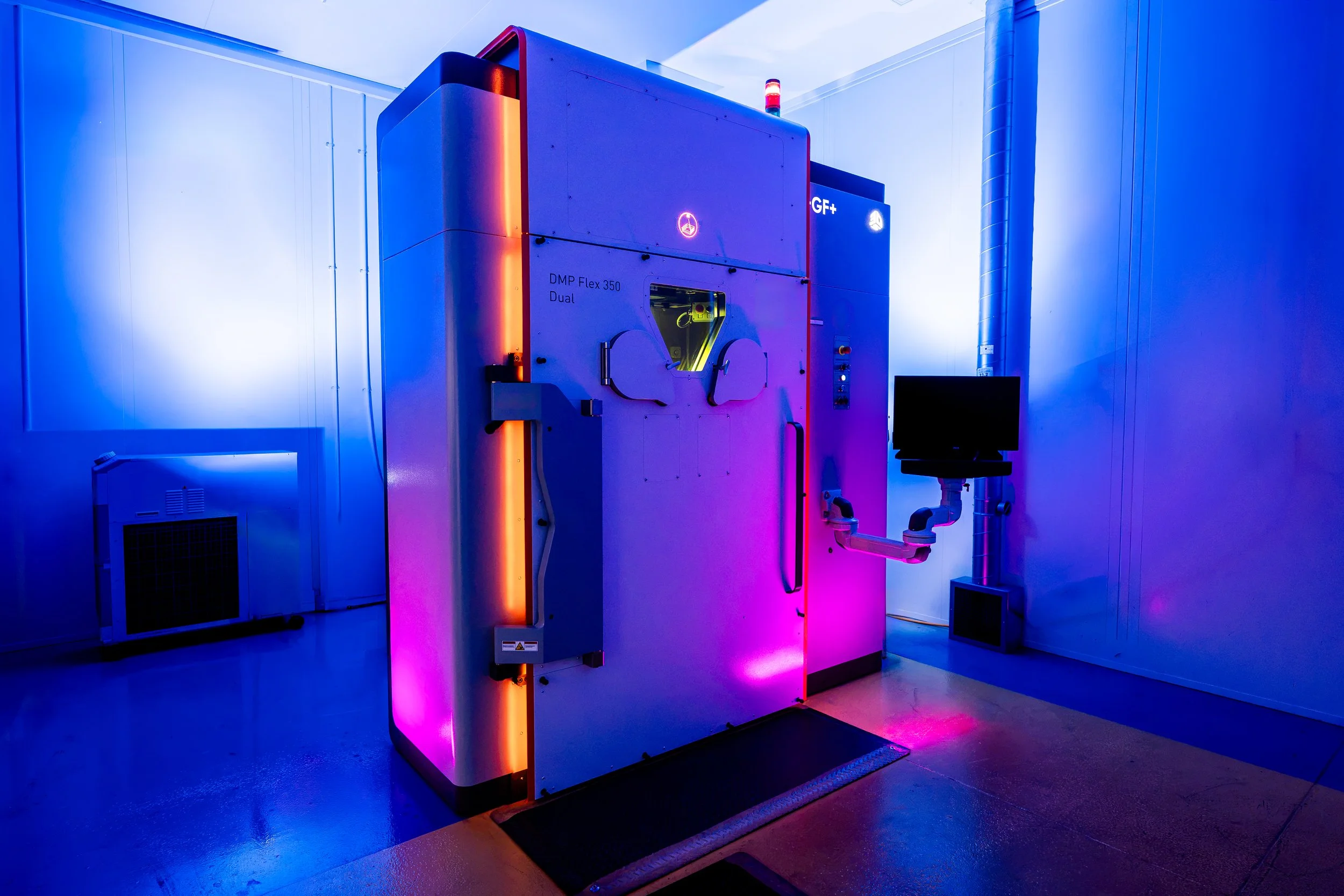 A photograph of a high tech 3-D printer at a Sheffield Factory 