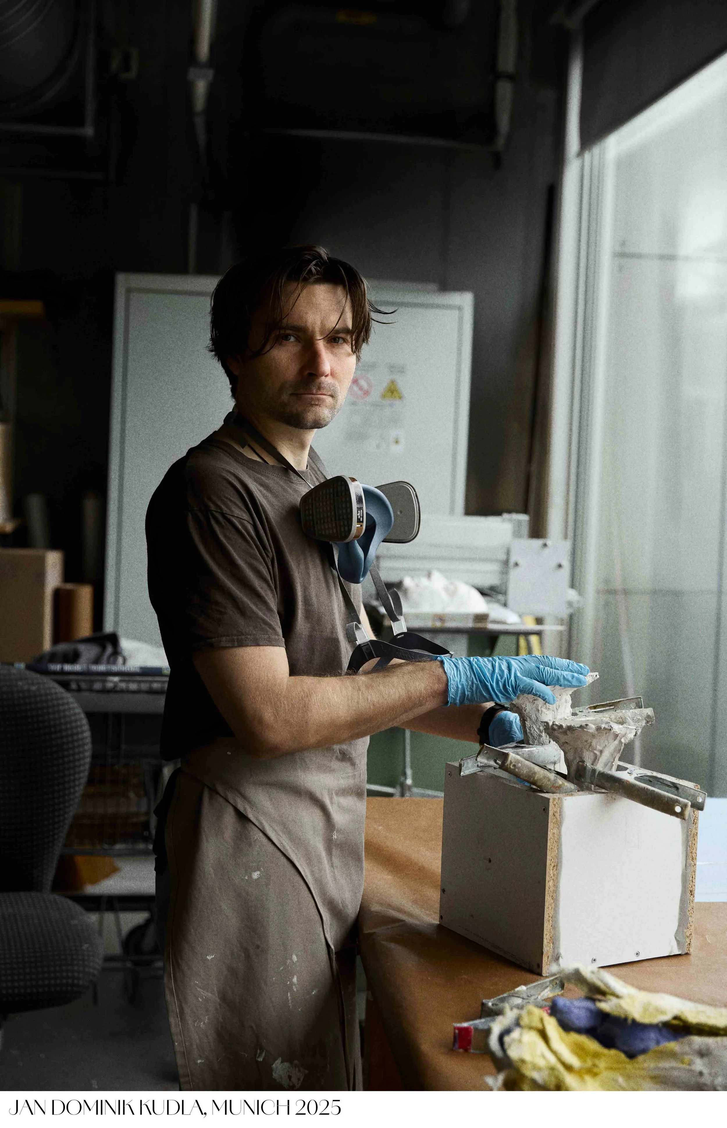 Portrait of a young male artist Jan Dominik Kudla working in studio captured by Tereza Konarikova