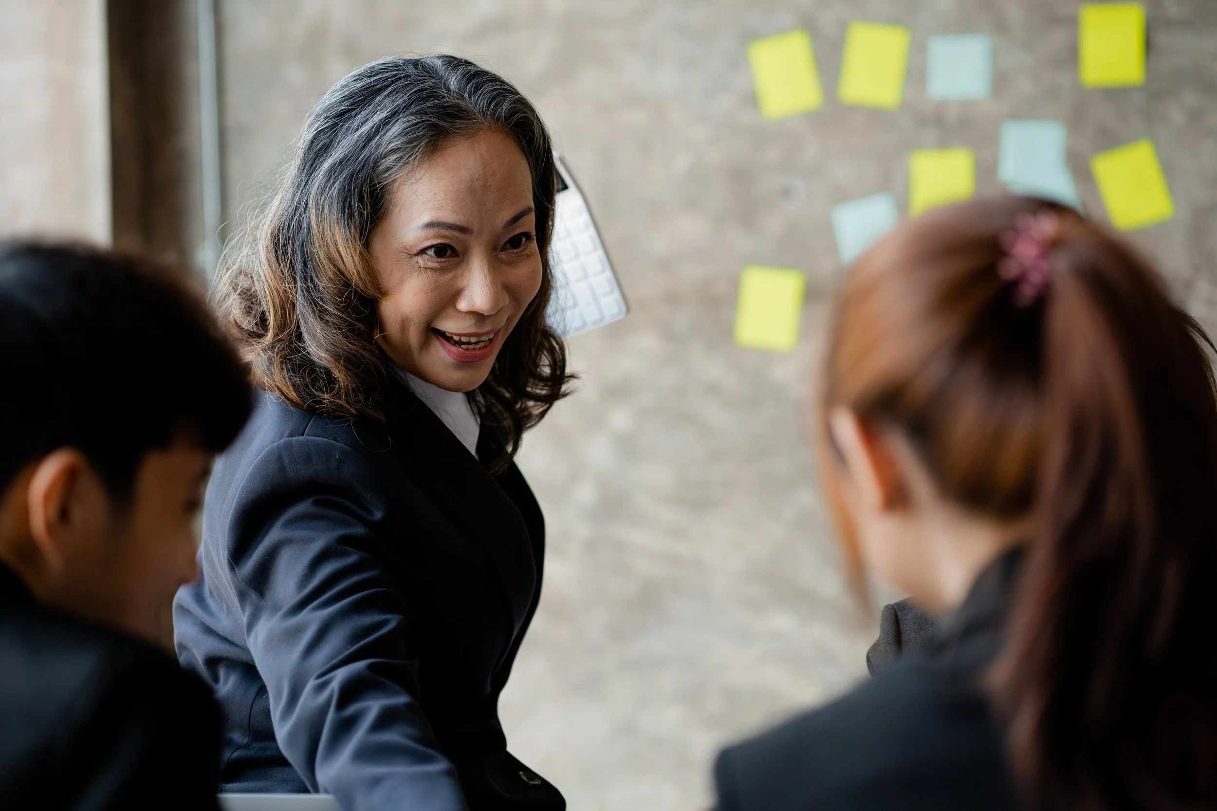 executive in leadership role greeting managers