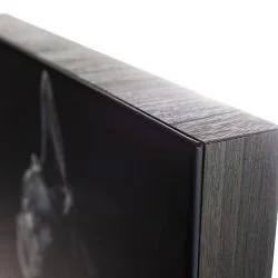 Close-up of the corner of a modern flat-screen television with a black frame.