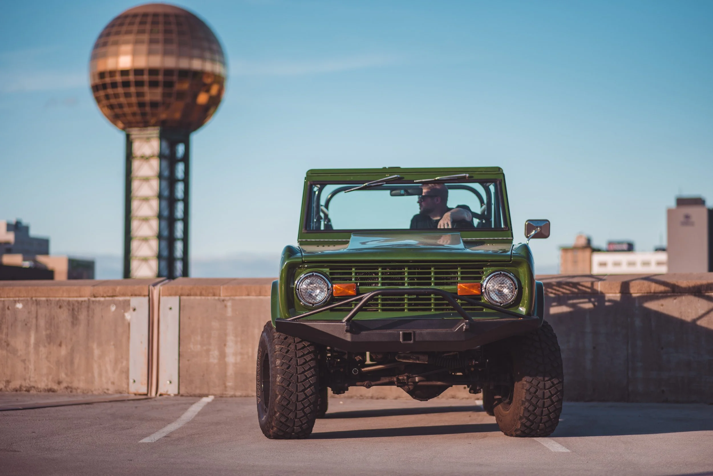 Brent In Bronco In Front Of sunsphere.JPG