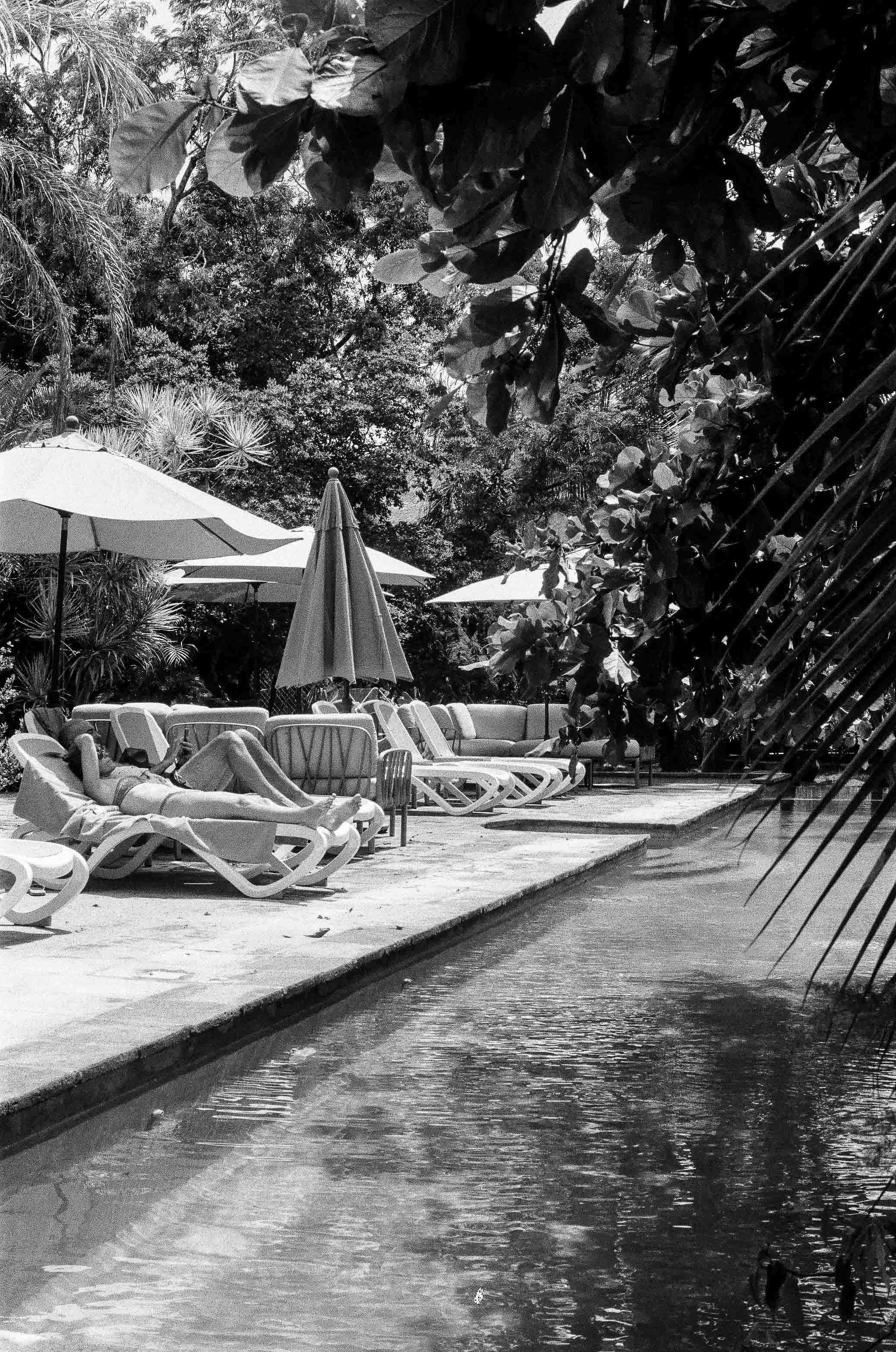 Tulum hotel pool sunbathers film photos