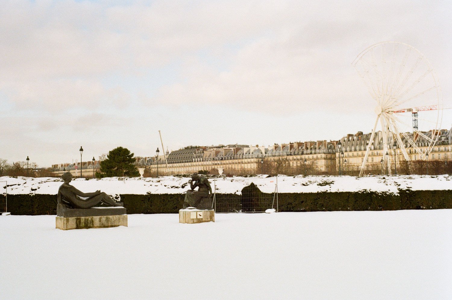 Statues and Tuileries with snow