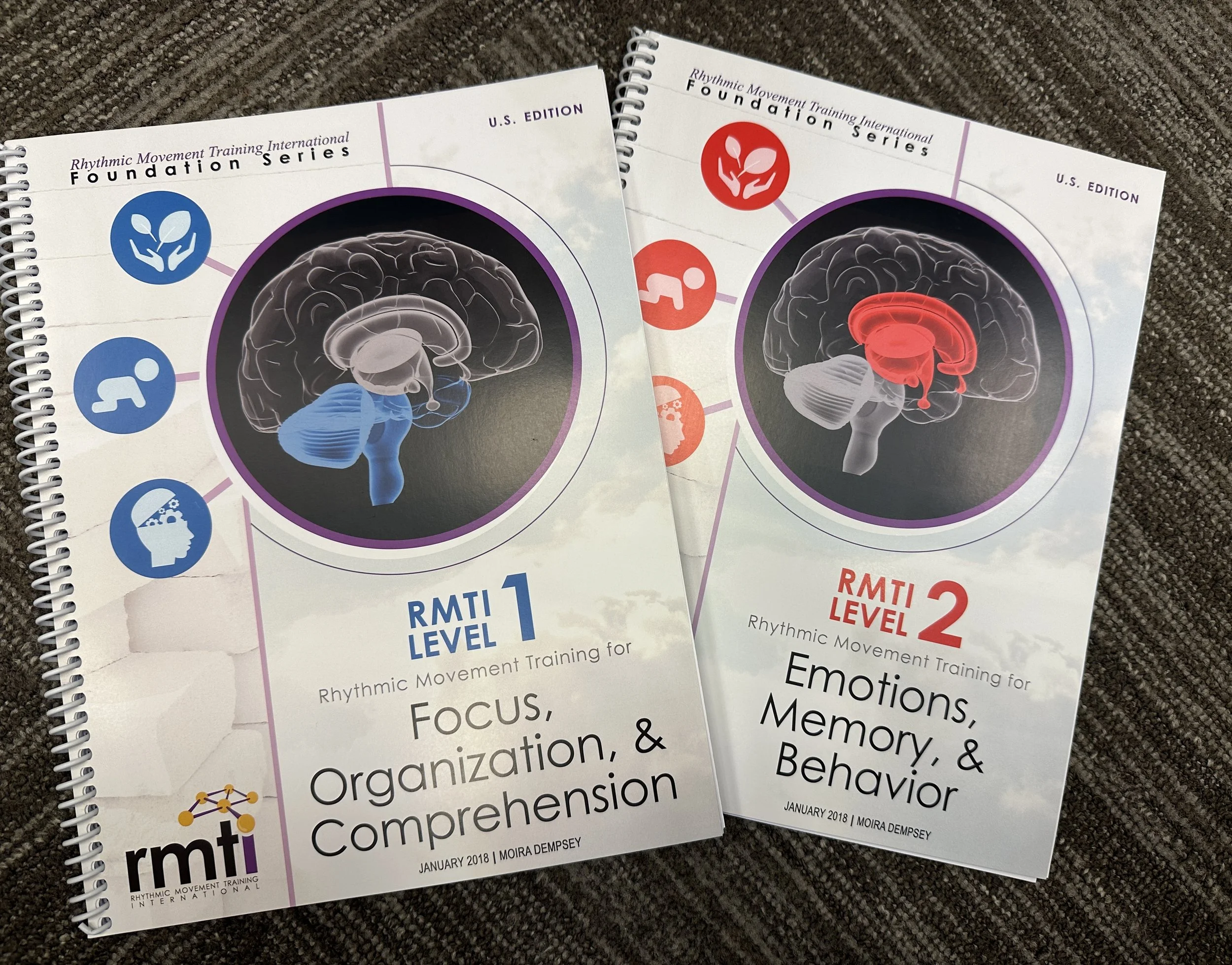 Rhythmic Movement Training International Level 1 and 2 manuals—reflecting on deepening knowledge, self-growth, and movement-based learning in Oregon.