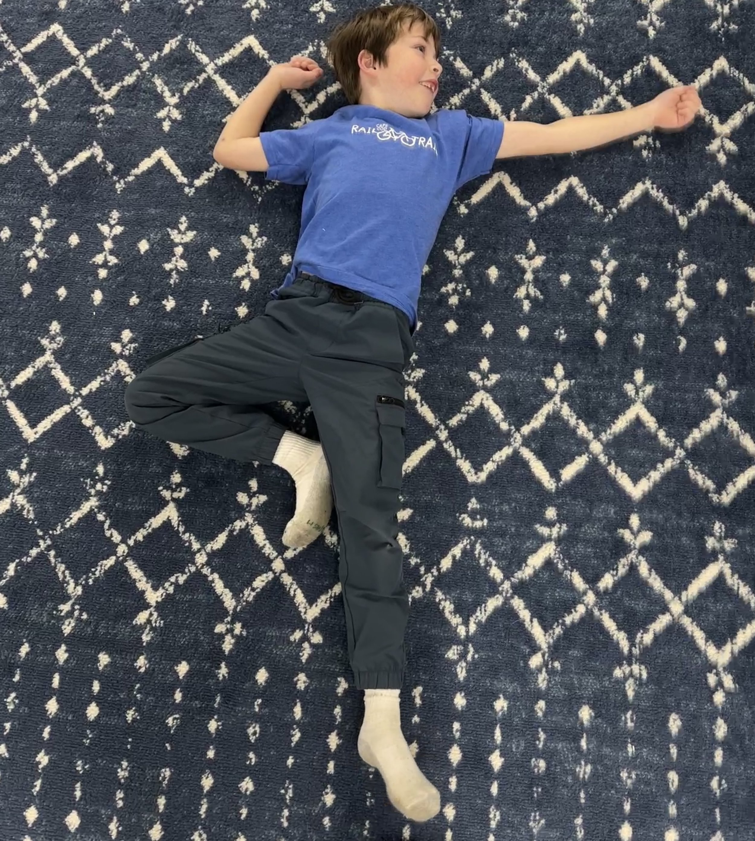 Child practicing Swords movement exercise to support Asymmetrical Tonic Neck Reflex (ATNR) integration and coordination