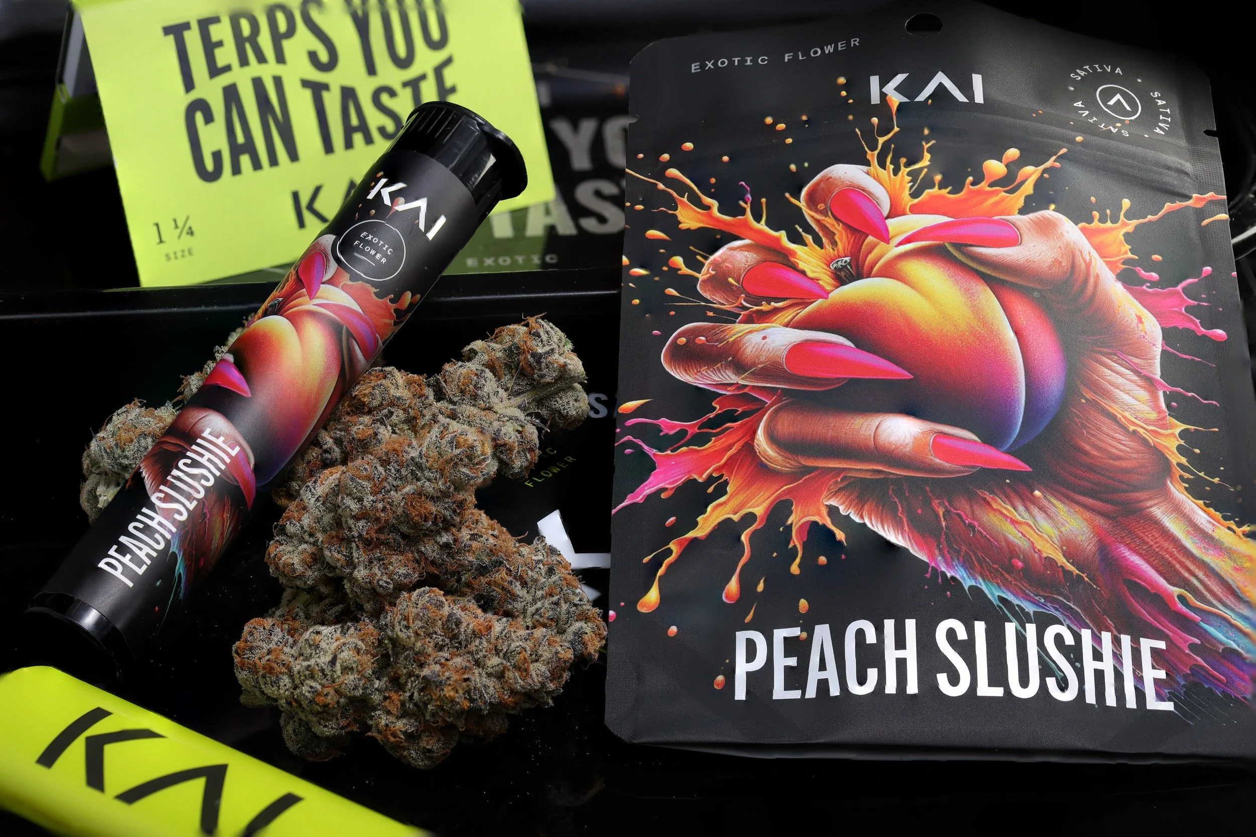KAI Cultivation Peach Slushie Flatlay of Packaging and Cannabis Bud
