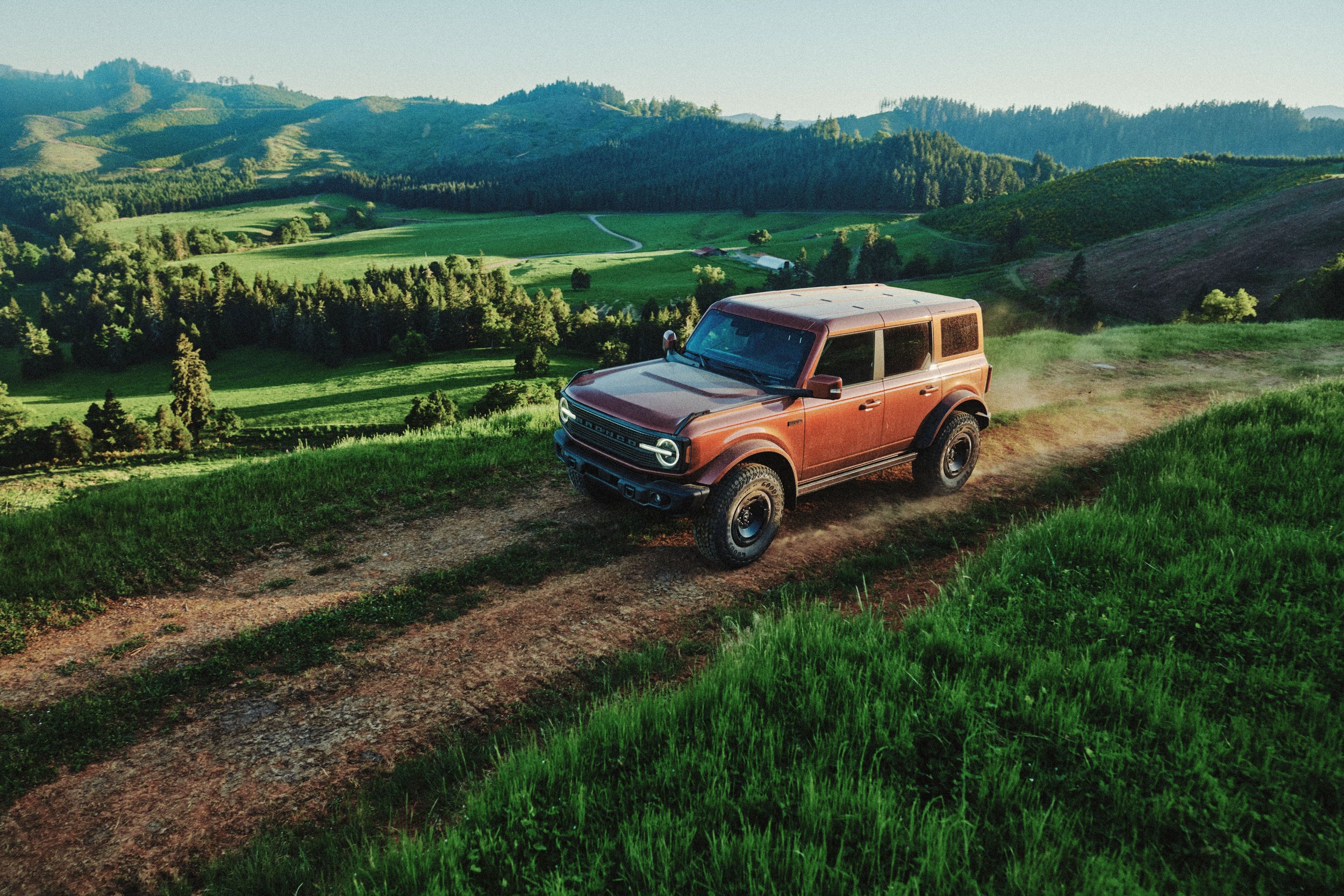 The 2027 Bronco Filson First Edition driving offroad through hillside terrain