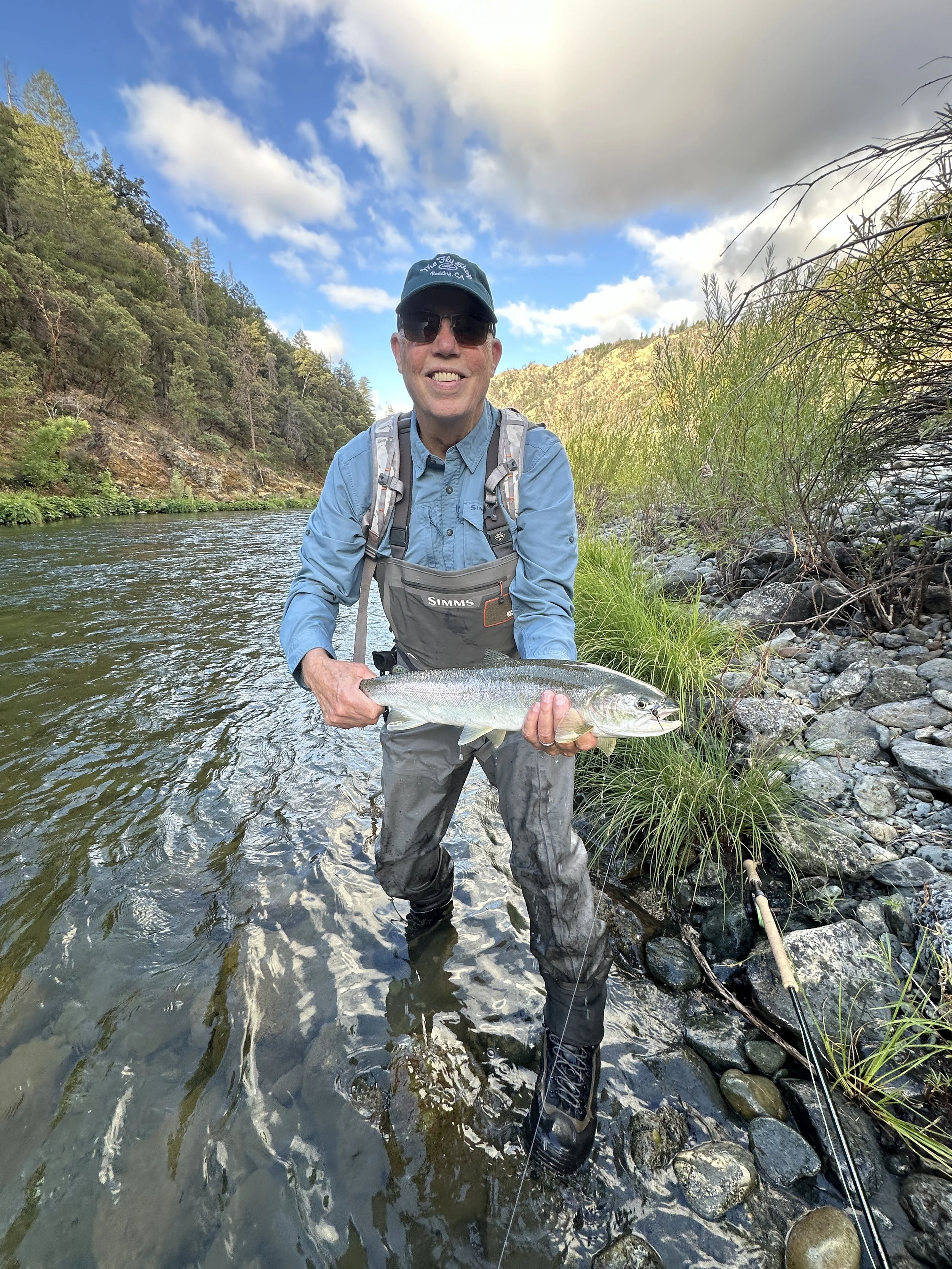 Man holding fish after healing from hip pain knee pain and tendonitis with Align