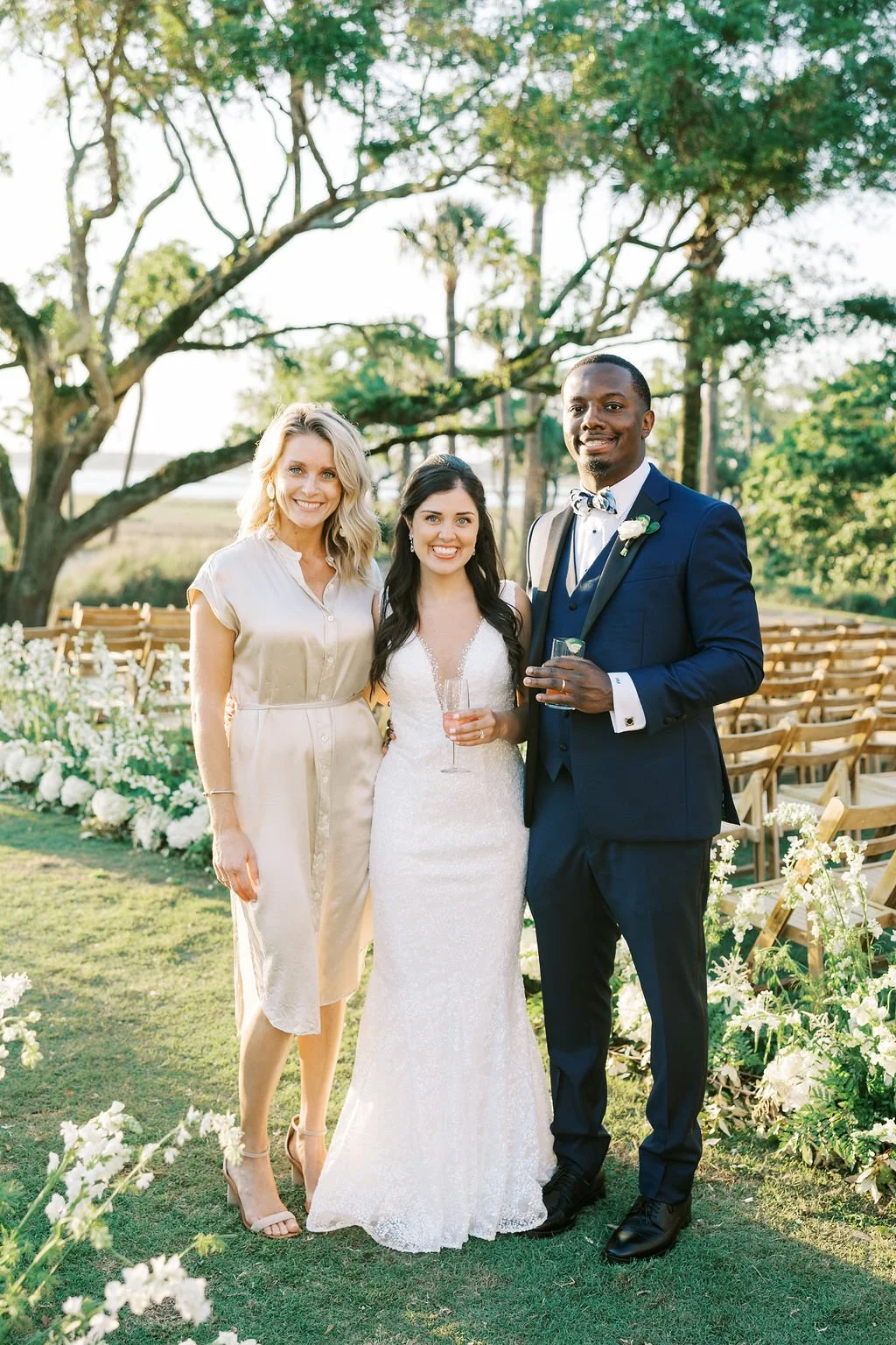 Reagan Events planner Reagan Prechter with newlyweds following their outdoor Kiawah Island wedding ceremony.