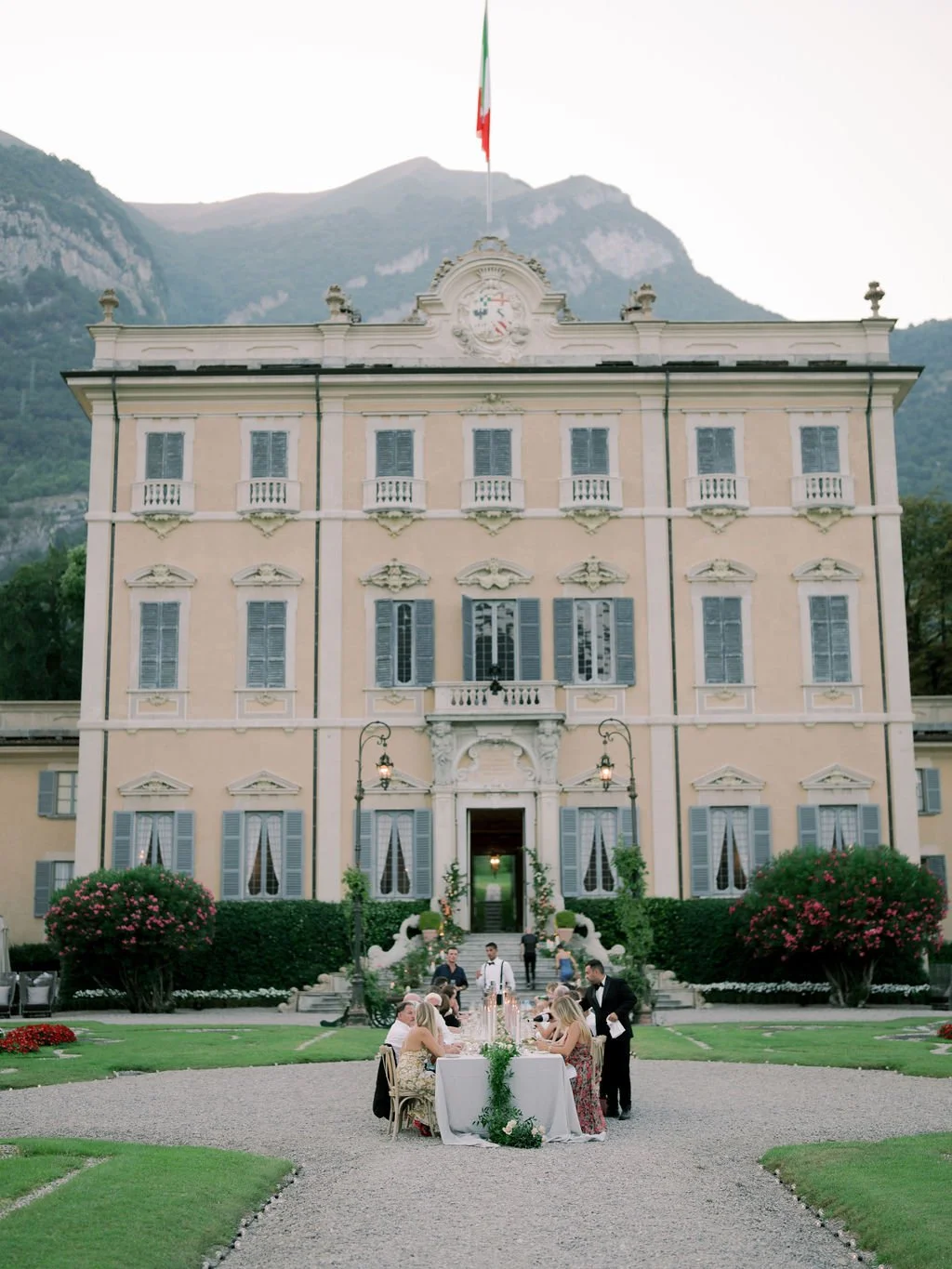 Intimate dinner set in front of a Lake Como villa for a sophisticated Italy destination wedding celebration.