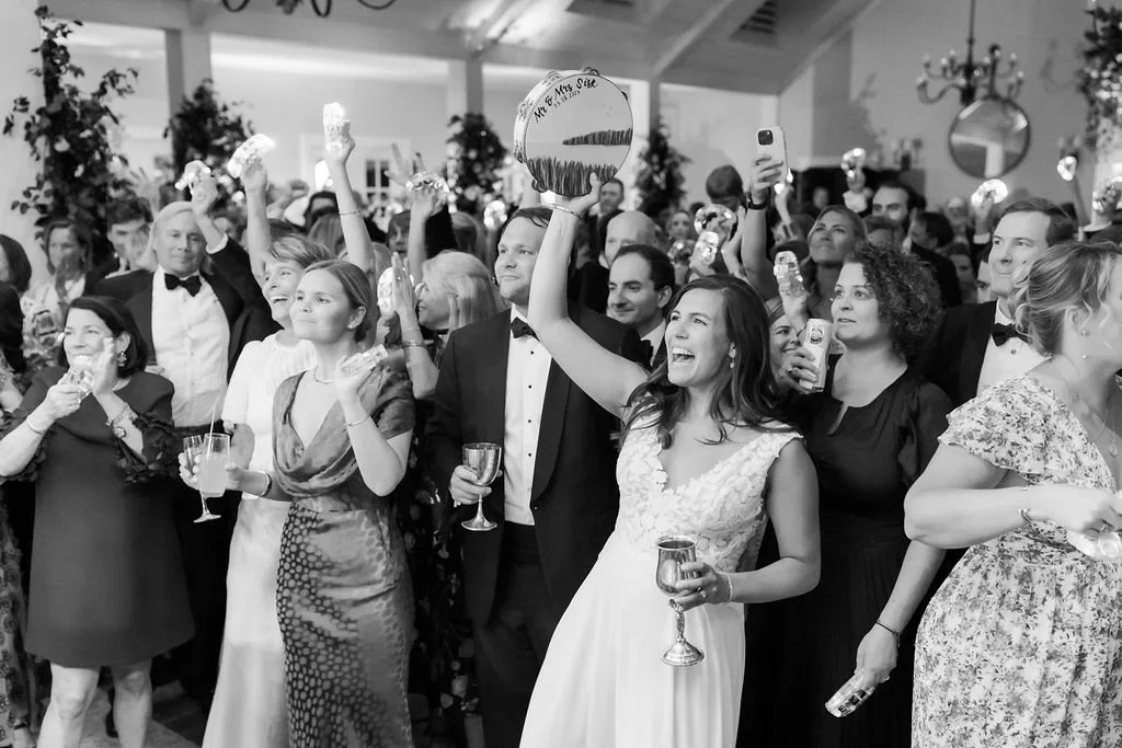 Wedding guests celebrating on the dance floor during a Kiawah Island wedding reception.