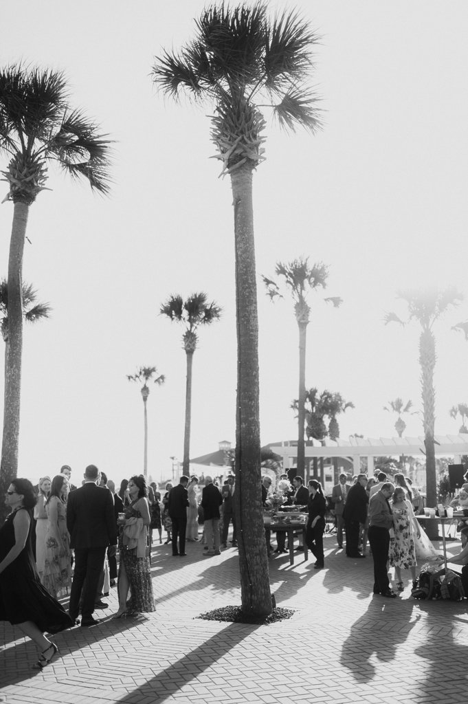 Guests enjoy a sunlit cocktail hour near tall palm trees by the coast.
Sean Money + Elizabeth Fay
Seabrook Island, South Carolina