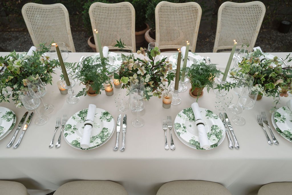 An elegant garden party table with green floral-patterned plates, lush greenery, and candlelit accents.
Anne Rhett Photography
Blossom Bay Design
Snyder Events
BBJ La Tavola
Emerson James Rentals
The Gibbes Museum of Art
Charleston, South Carolina