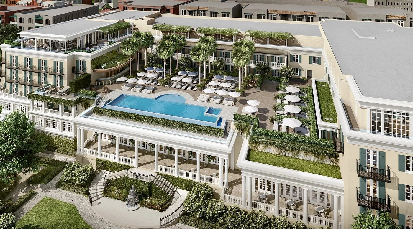 Rooftop pool terrace rendering at The Cooper in Charleston, with palm-lined seating, white umbrellas, and a harbor-facing backdrop.