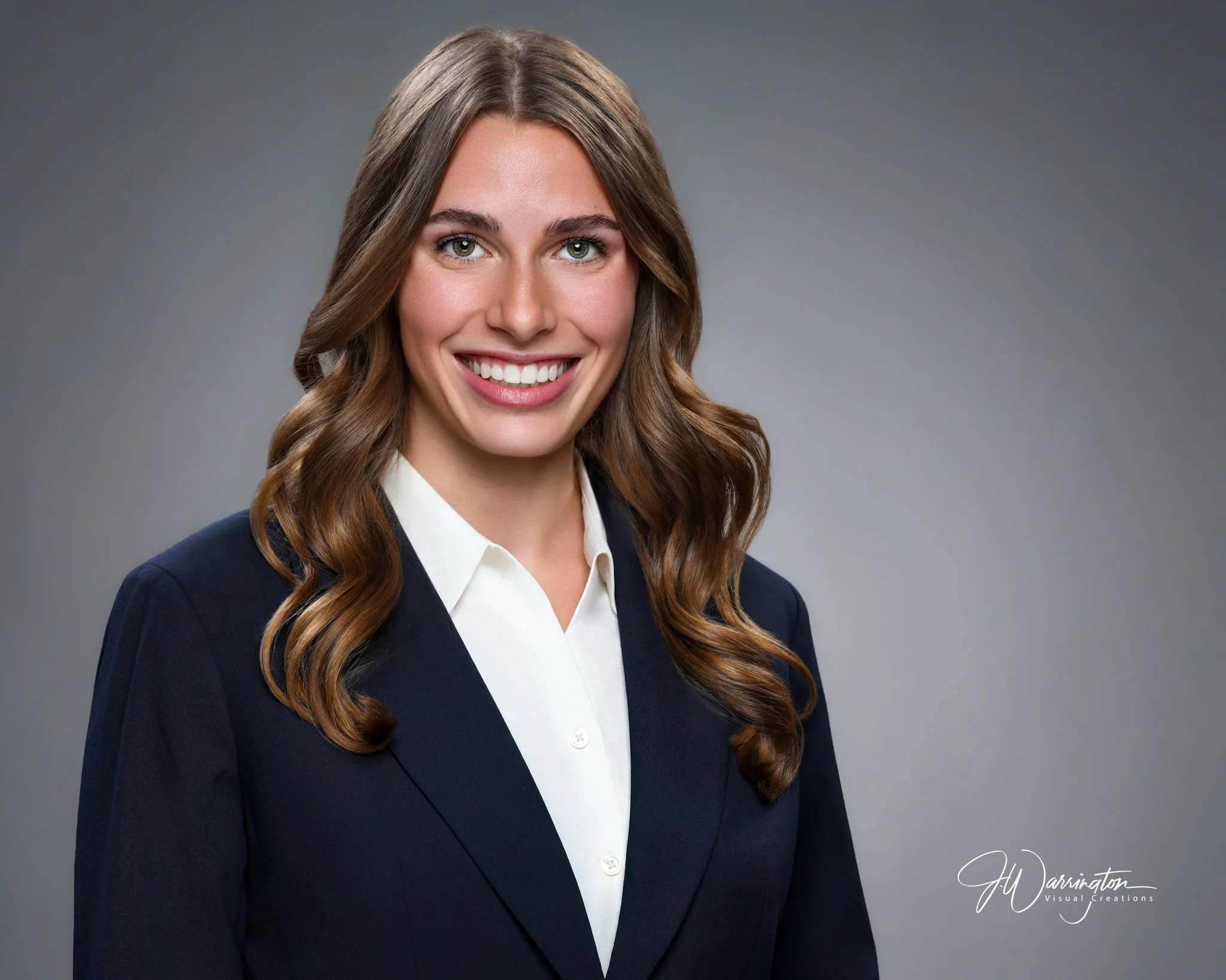 Pretty blonde young adult professional headshot gray brackground by findlay ohio photographer 