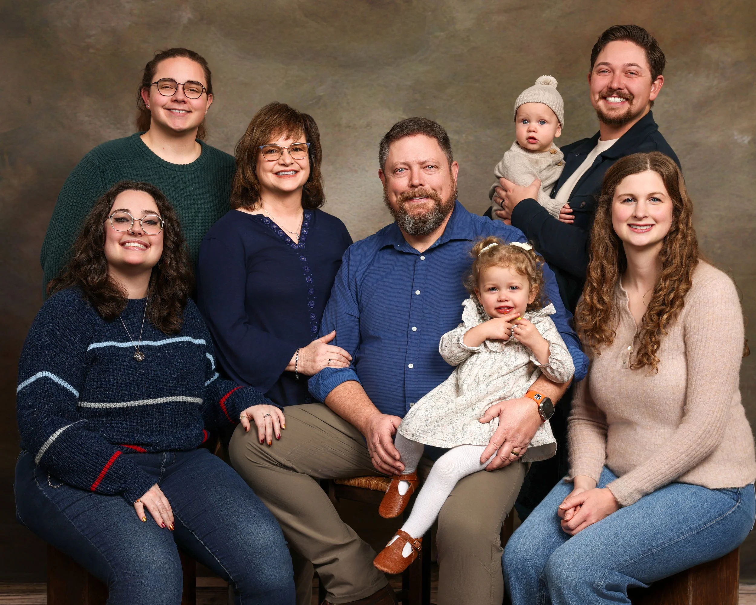 Large group family photos with neutral background scheme by J. Warrington Visual Creations in Findlay, Ohio.