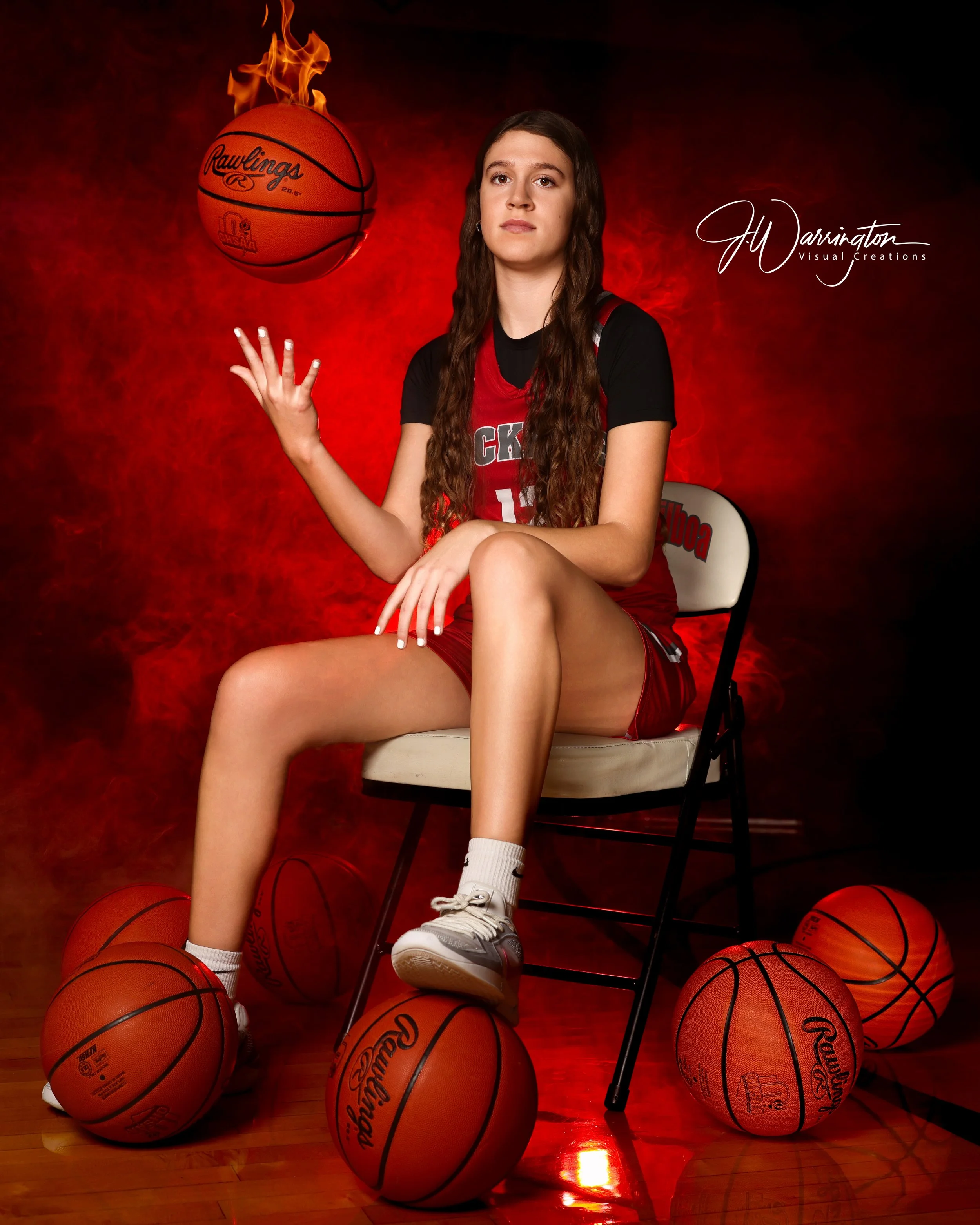 Female senior basketball player dramatic light image with fire.