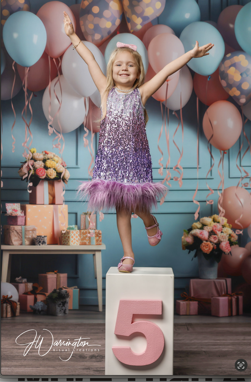 Sweet 5 year old birthday photography little girl wearing purple sparkly dress and blue and pink balloons in background standing on box by findlay photographer