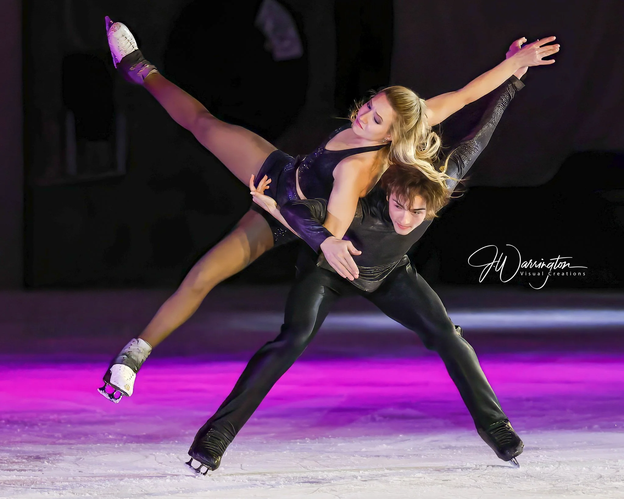 Two professional figure skaters perform a dynamic lift during captured by a Northwest Ohio photographer