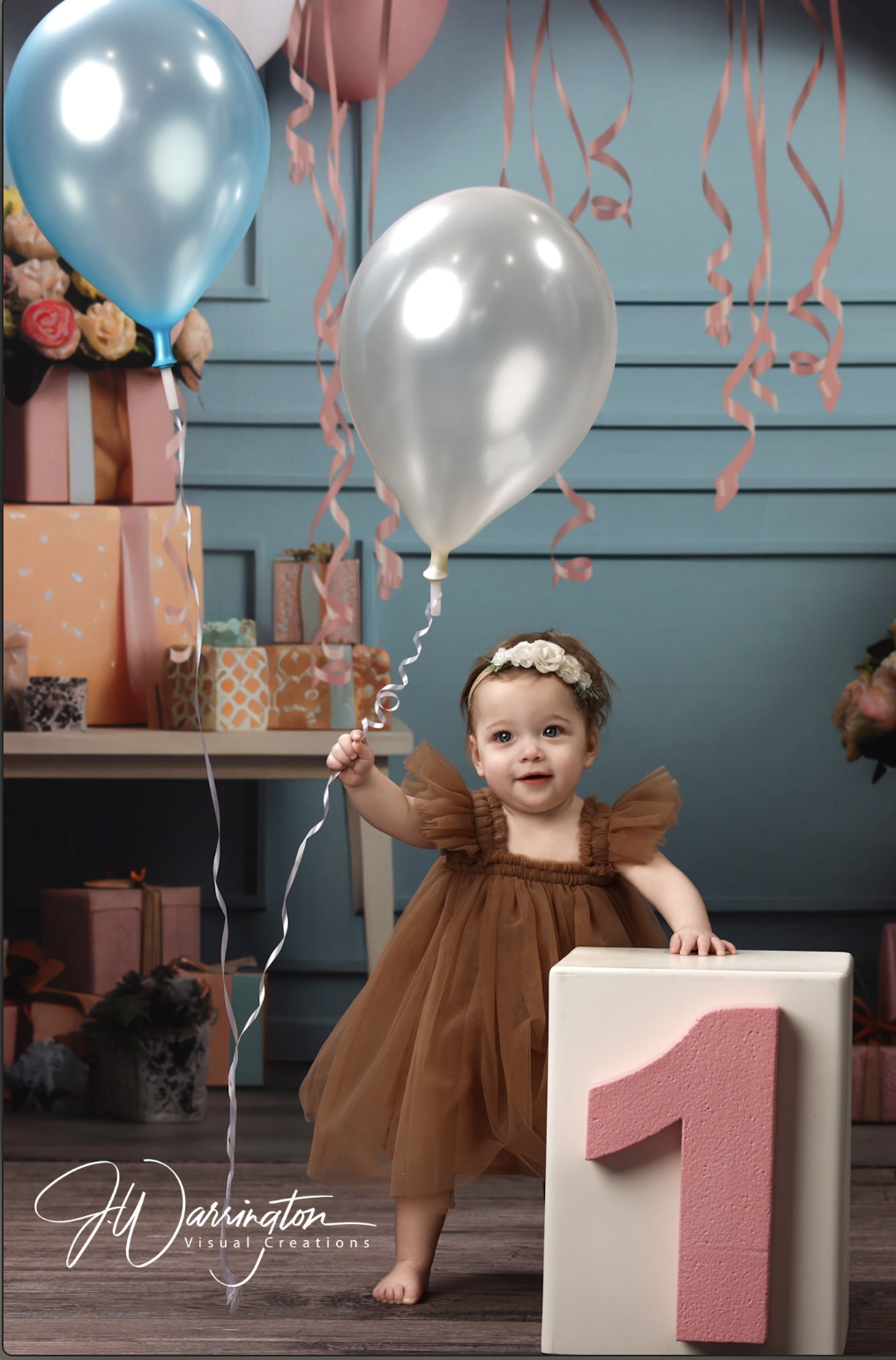 Sweet milestone photography 1 year old girl i brown dress with baloons and pink and blue theme by findlay photographer