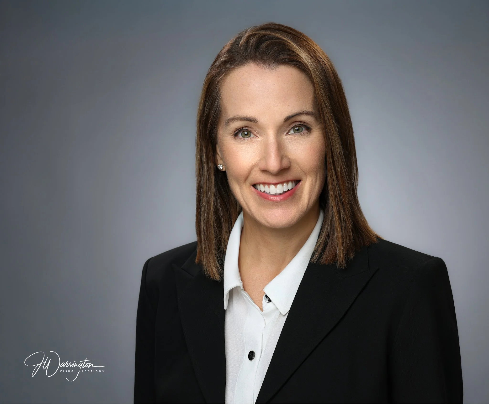 Brunette female professional headshot gray brackground by northwest ohio photographer 