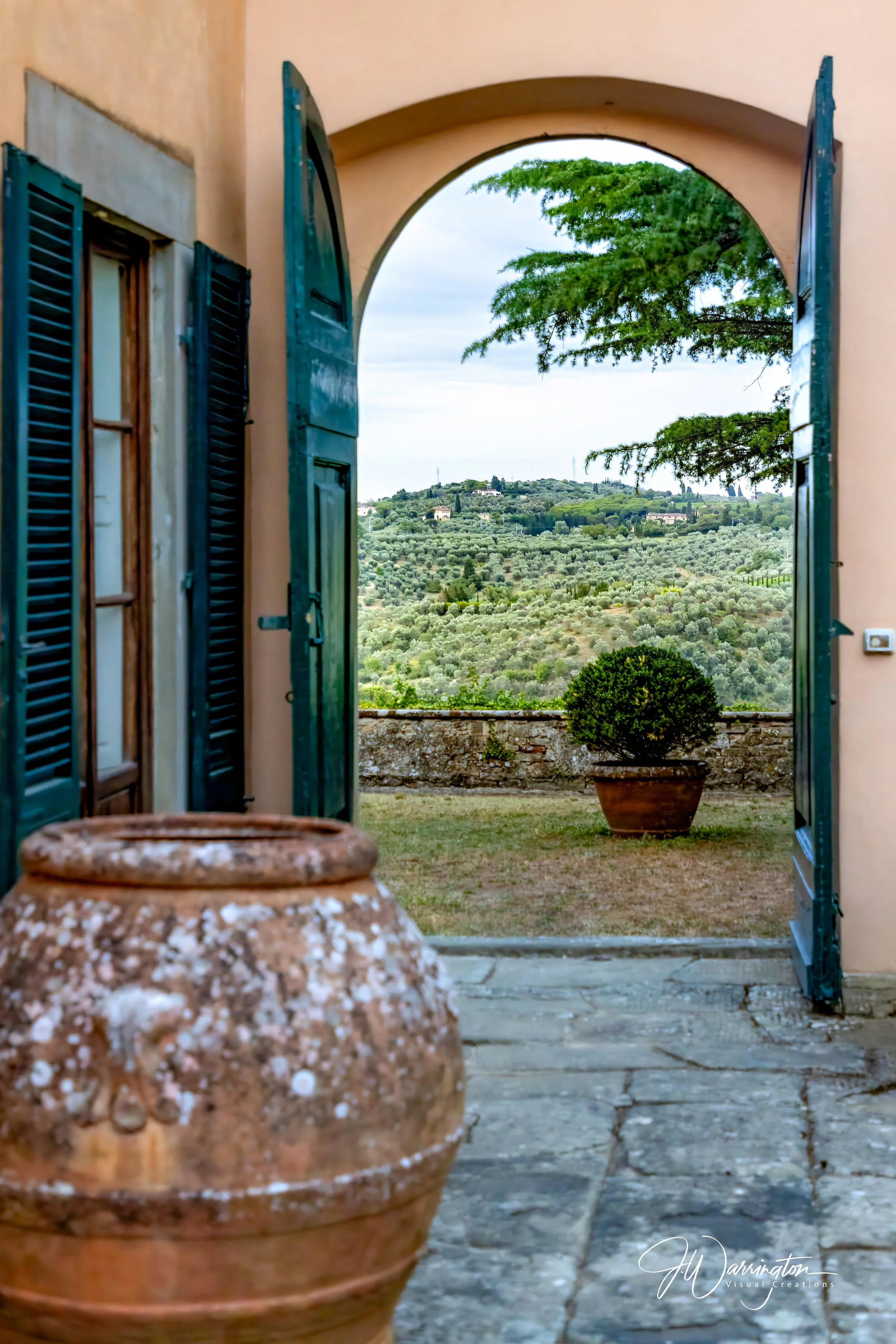 Tuscany Valley image shot through the door of 1500’s winery in Italy taken by Northwest Ohio photographer.