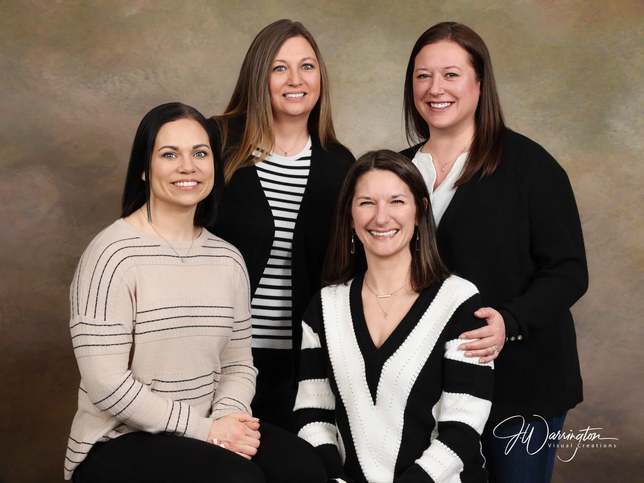 Big family photos with tan backdrop and black and white clothing by northwest ohio photographer