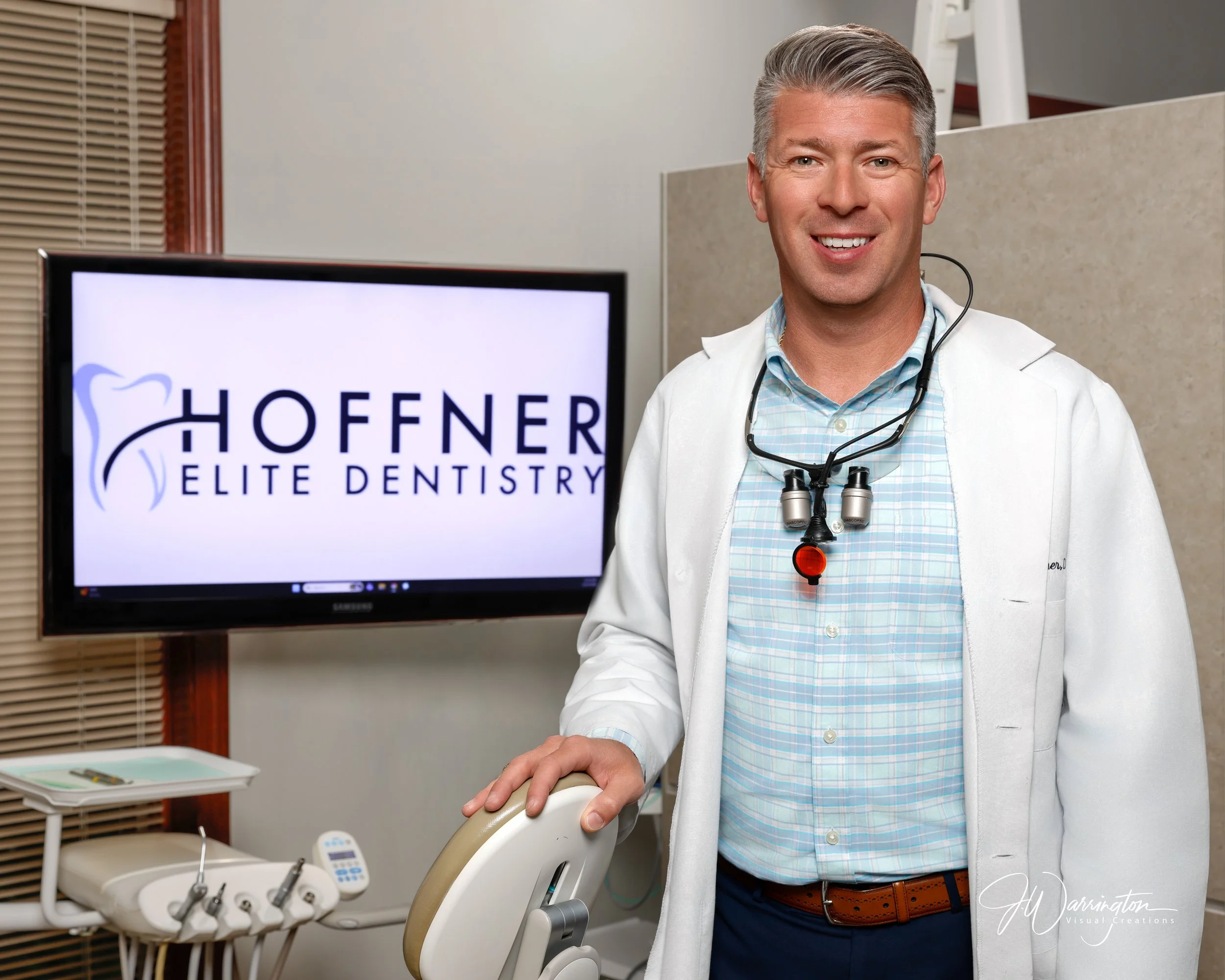 Professional commercial branding headshot of a smiling dentist Hoffner Elite Dentistry.