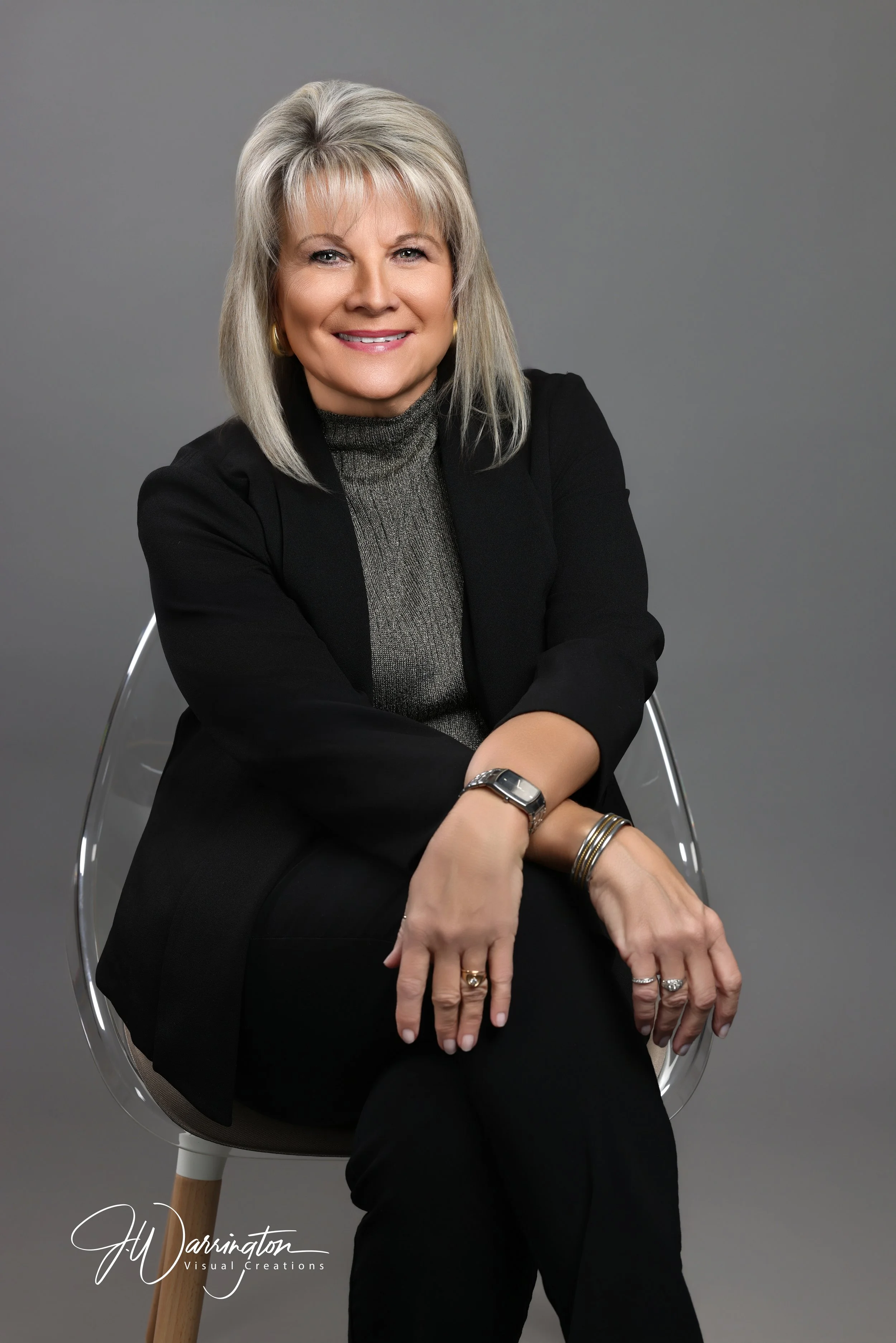 Women seated smiling headshot