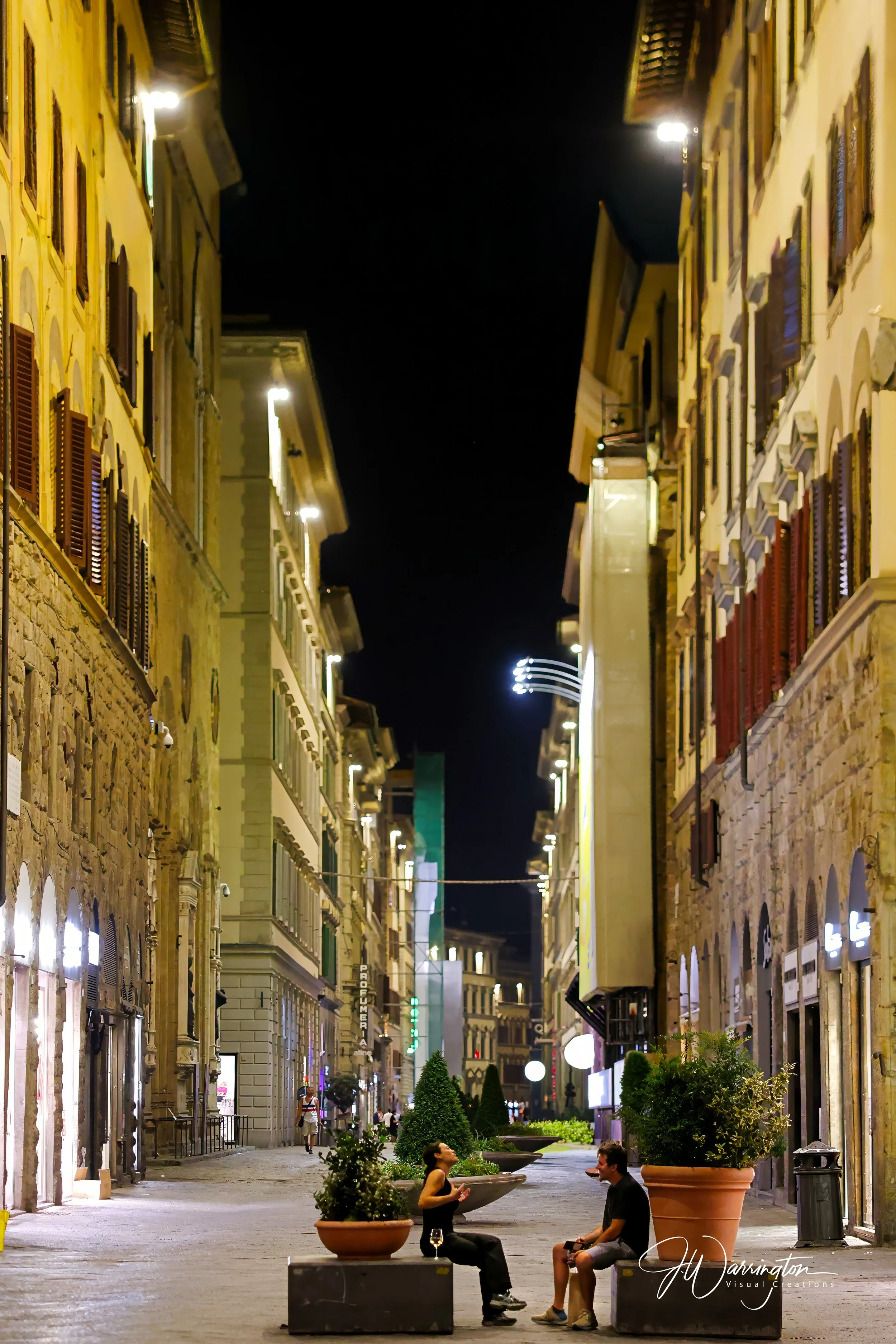 Florence, Italy, intimate conversation captured between a female and male, taken by Northwest Ohio photographer.