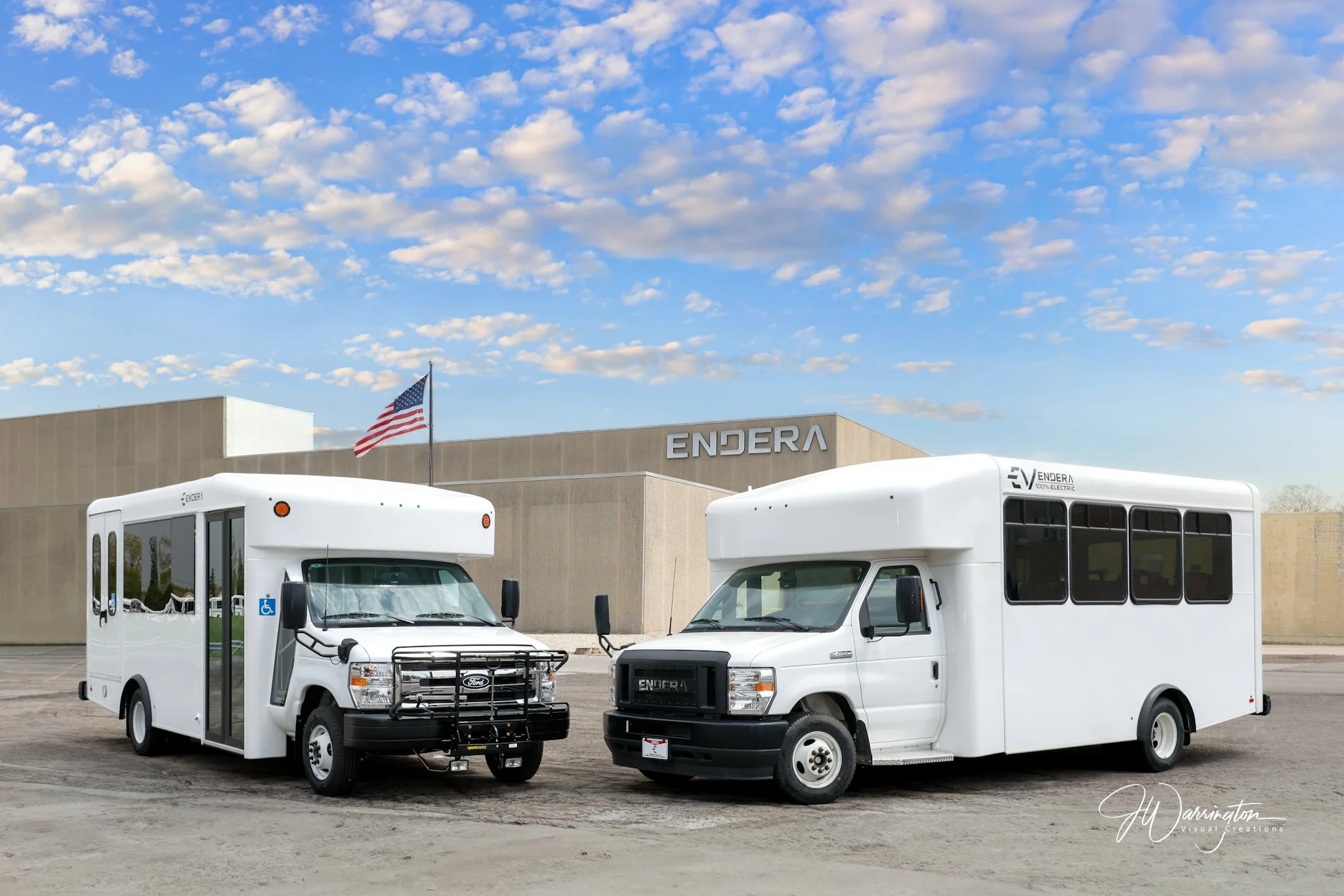 White multi-passenger shuttle buses parked outdoors on a bright, clear day captured by  Northwest Ohio photographer