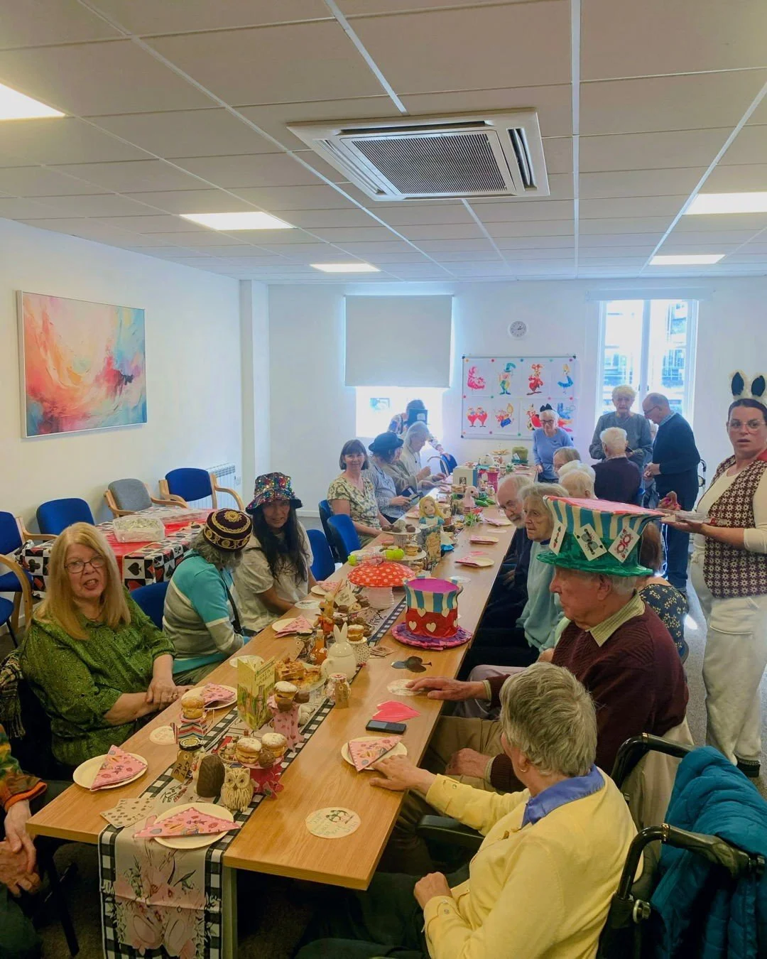 We went down the rabbit hole for National Mad Hatter Tea Party Day! 🎩🐇🪄

Our Memory caf&eacute; had the most wonderfully whimsical Alice in Wonderland Tea Party, complete with the Queen of Hearts, the Mad Hatter, and even the Cheshire Cat!🐈
 
Ben
