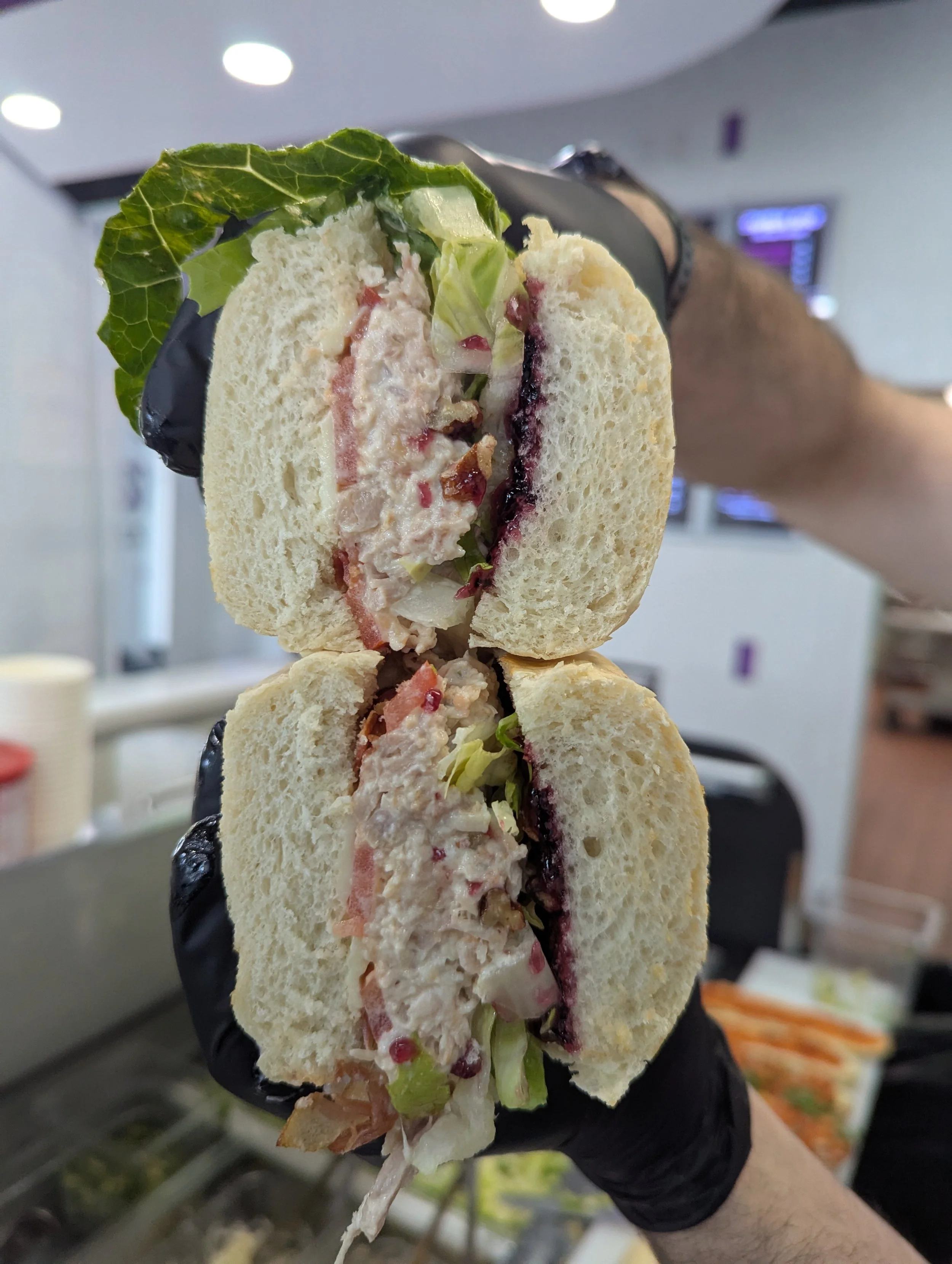 Purple Rain Sandwich:
Chicken salad, white American cheese, bacon, lettuce, tomato, crumbled pecans, grape jam