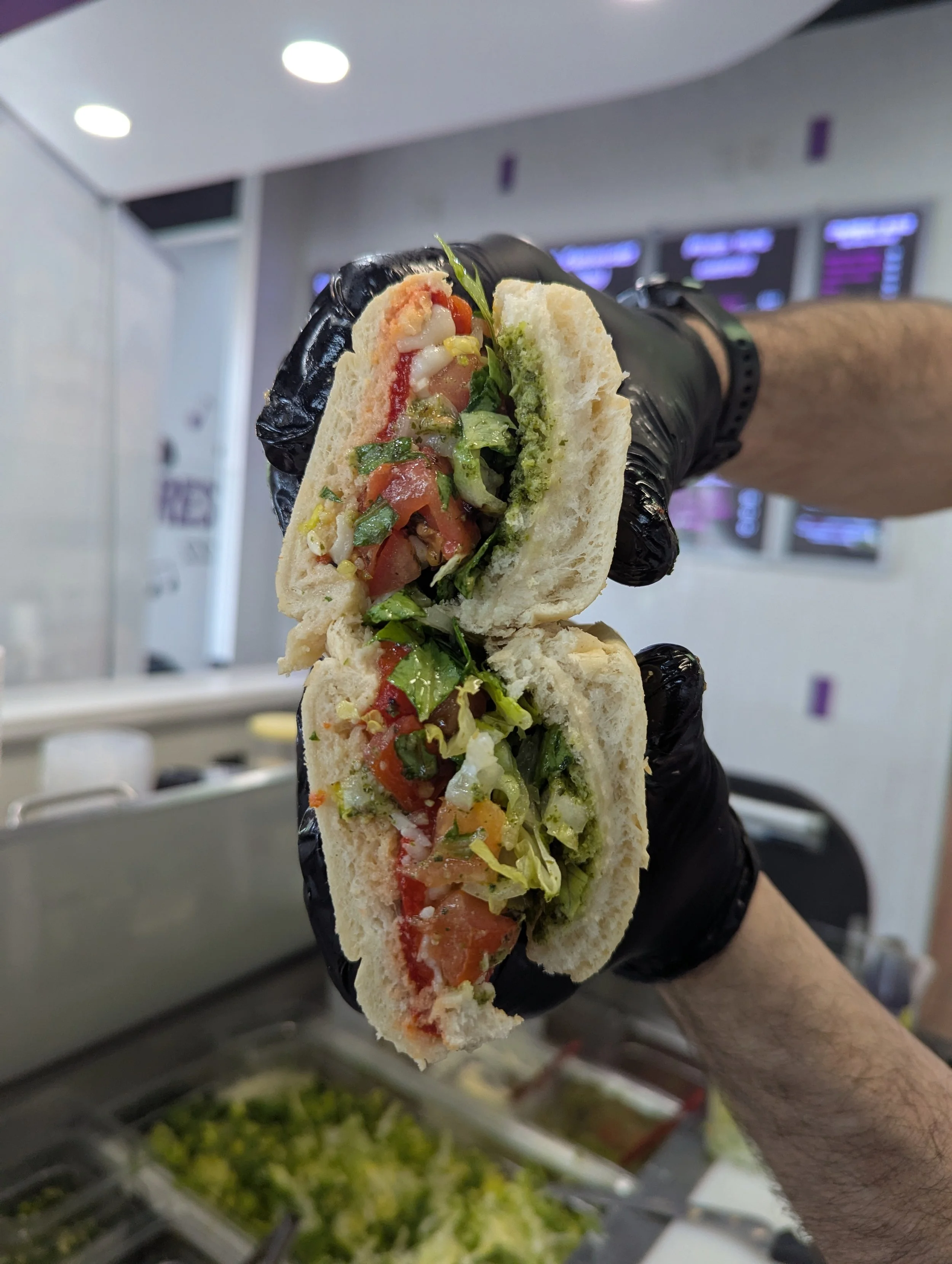 Tomato Swift Sandwich:
Roasted red pepper, mozzarella cheese, bruschetta, pesto, balsamic glaze, dressed lettuce