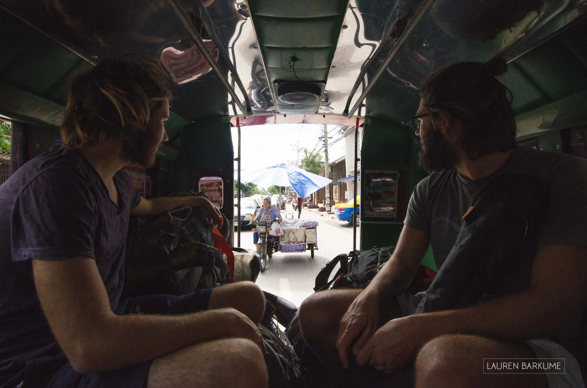 Fellow travelers from Germany share a taxi after taking the night train to Chiang Mai from Bangkok.