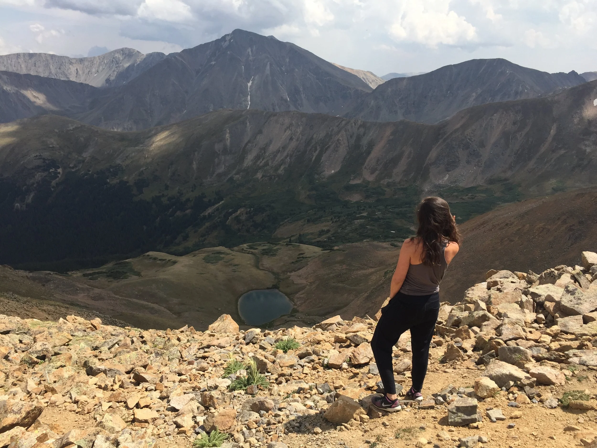Image of Jessica Ghantous in mountains overlooking lake.