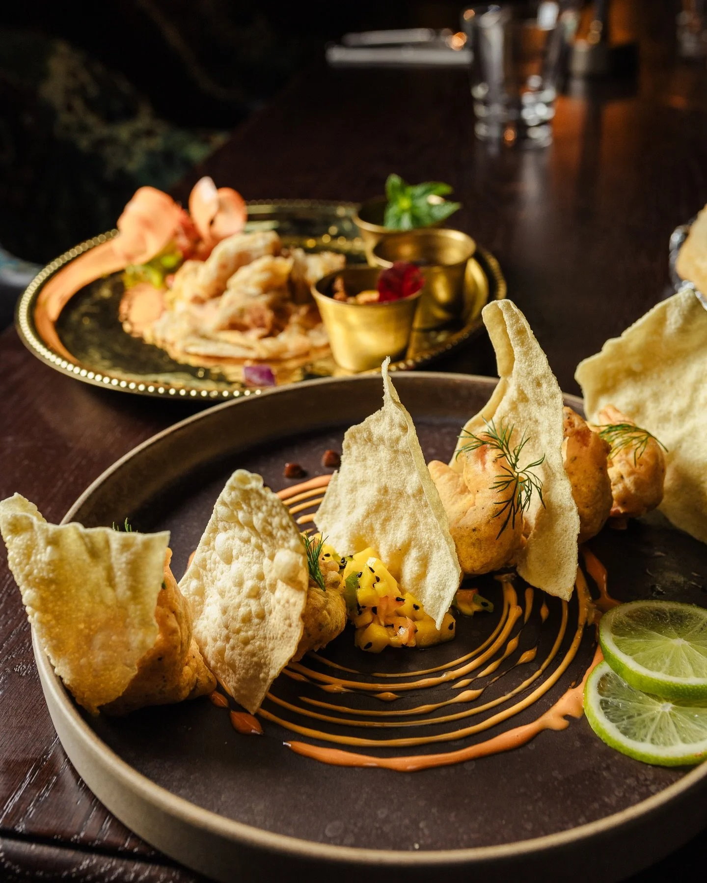 Daata&rsquo;s Prawn Pakoras 

A plate of delicate, crispy morsels in a gentle batter of spiced gram flour. Fried golden crisp and perfectly paired along our homemade chutneys like mint or mango!