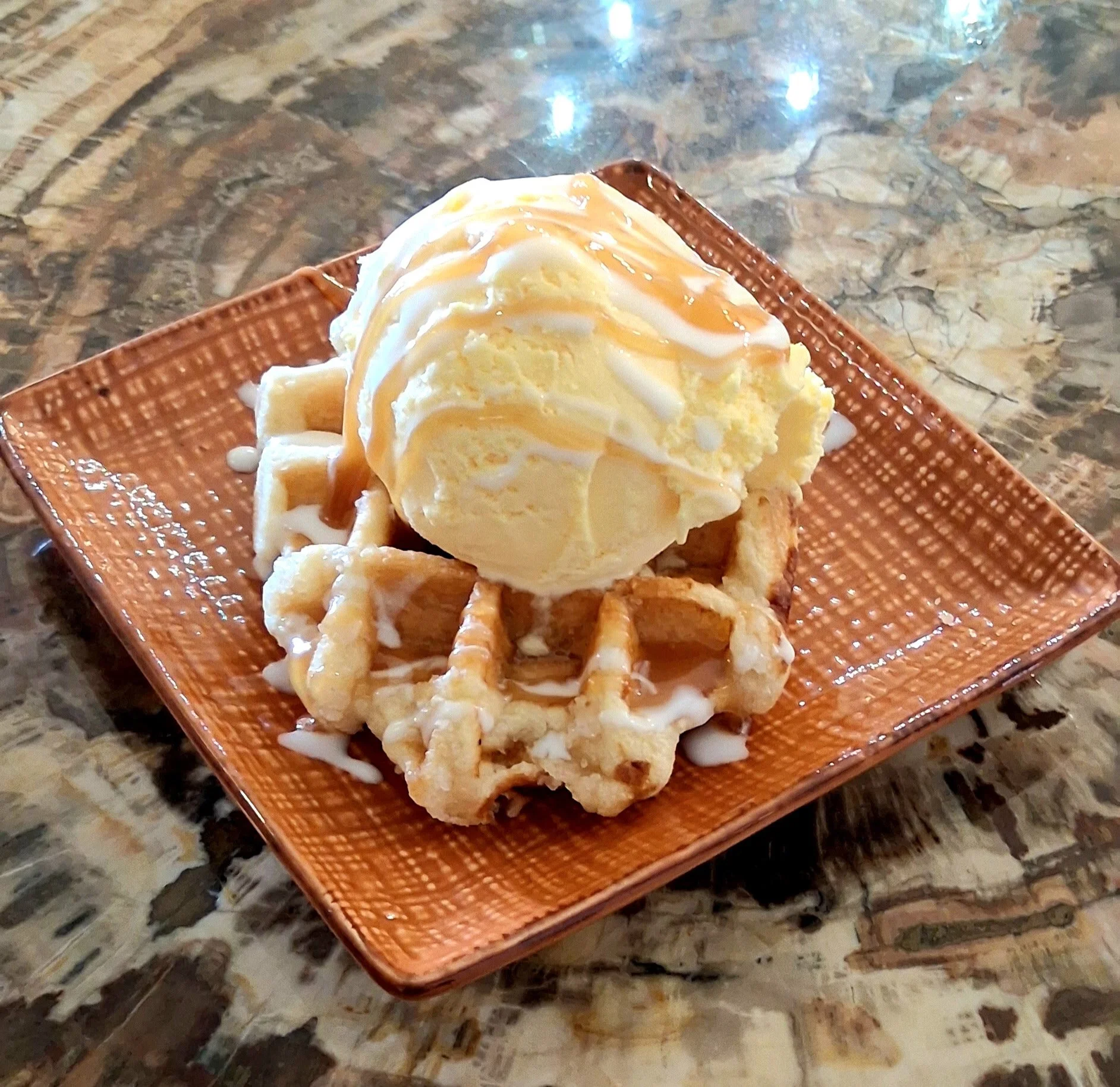 This week&rsquo;s Beehive Caf&eacute; special 🍯

Mini Belgian waffle topped with creamy vanilla ice cream, finished with caramel and white chocolate drizzle.

Warm. Cold. Sweet. Slightly dangerous.

Come get it before it&rsquo;s gone.