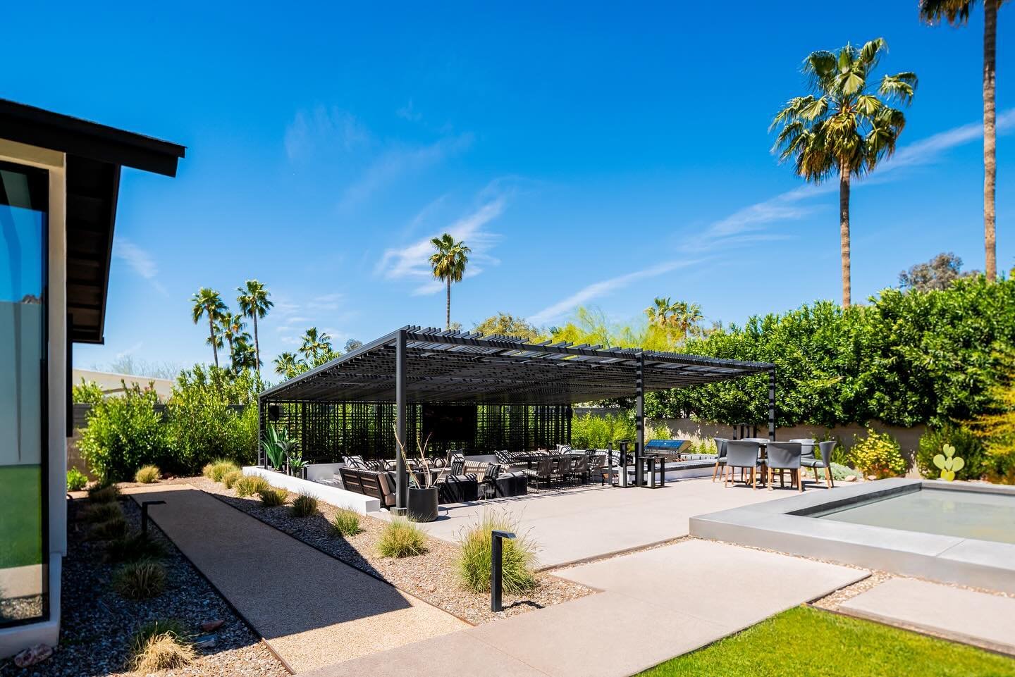We are excited to share with you our recently completed patio trellis shade structure for a residence in Phoenix, AZ! The design explores layering slats in opposing directions to create a lattice-like canopy to shelter the outdoor living area below. 