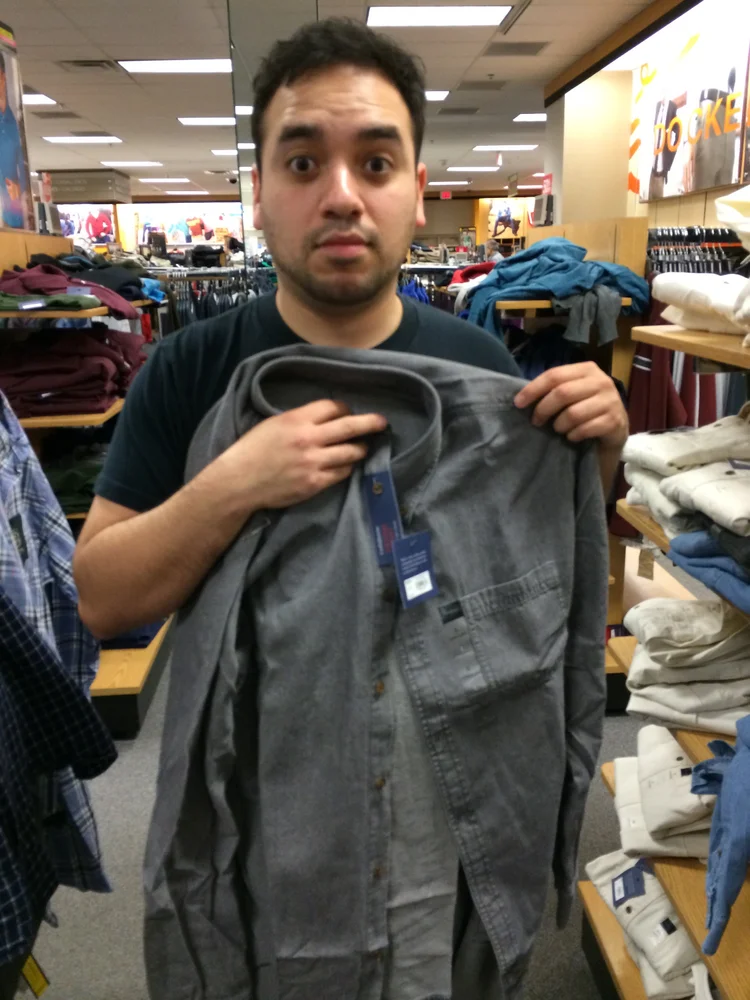 Chris Cairo selecting wardrobe for Chico Mendez