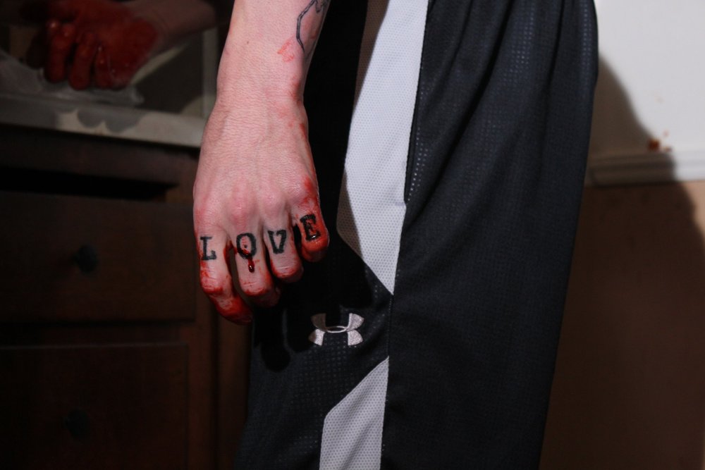 Bennie's bloodied tattoos in Dead Right