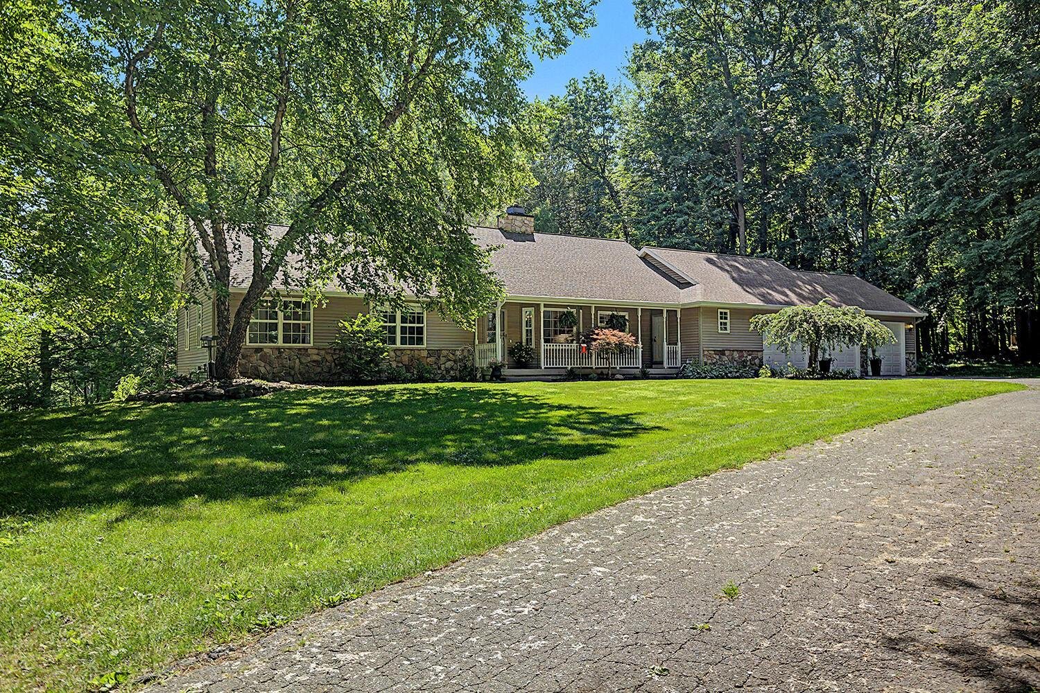 Lovely Ranch home on 7.5 Acres In Lowell!