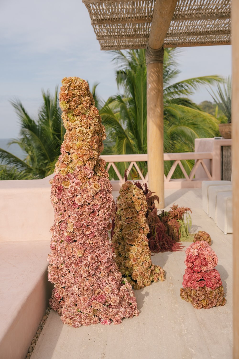 Aesthetic destination wedding in Mexico with sculptural florals and ocean views photographed by Mexico destination wedding photographer Victoria Kait