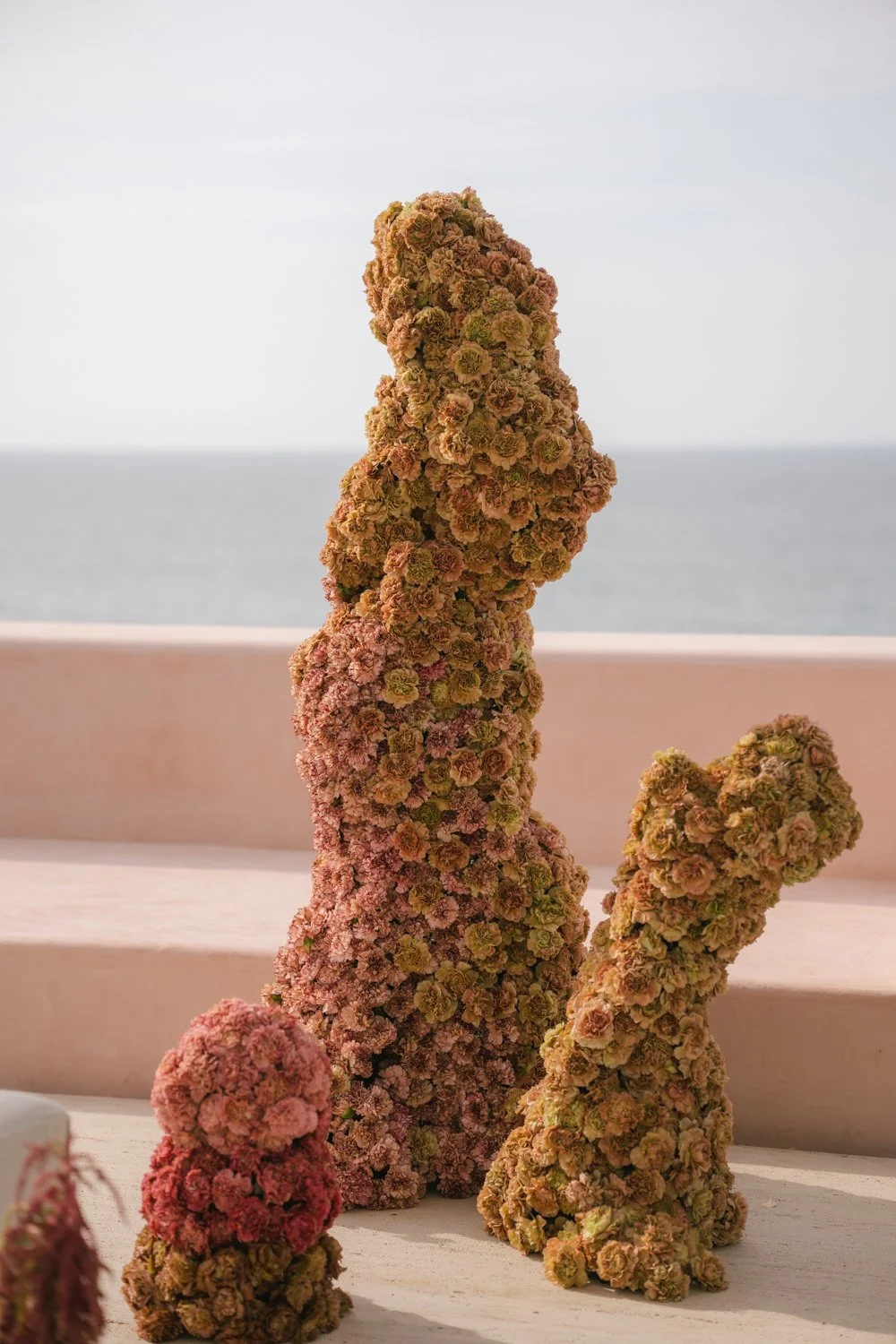 Aesthetic destination wedding in Mexico with sculptural florals and ocean views photographed by Mexico destination wedding photographer Victoria Kait