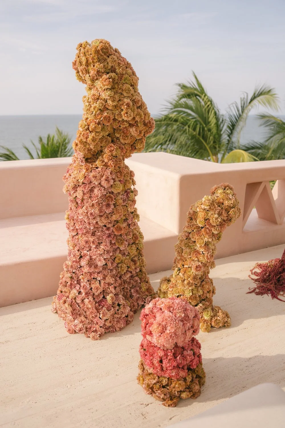 Aesthetic destination wedding in Mexico with sculptural florals and ocean views photographed by Mexico destination wedding photographer Victoria Kait